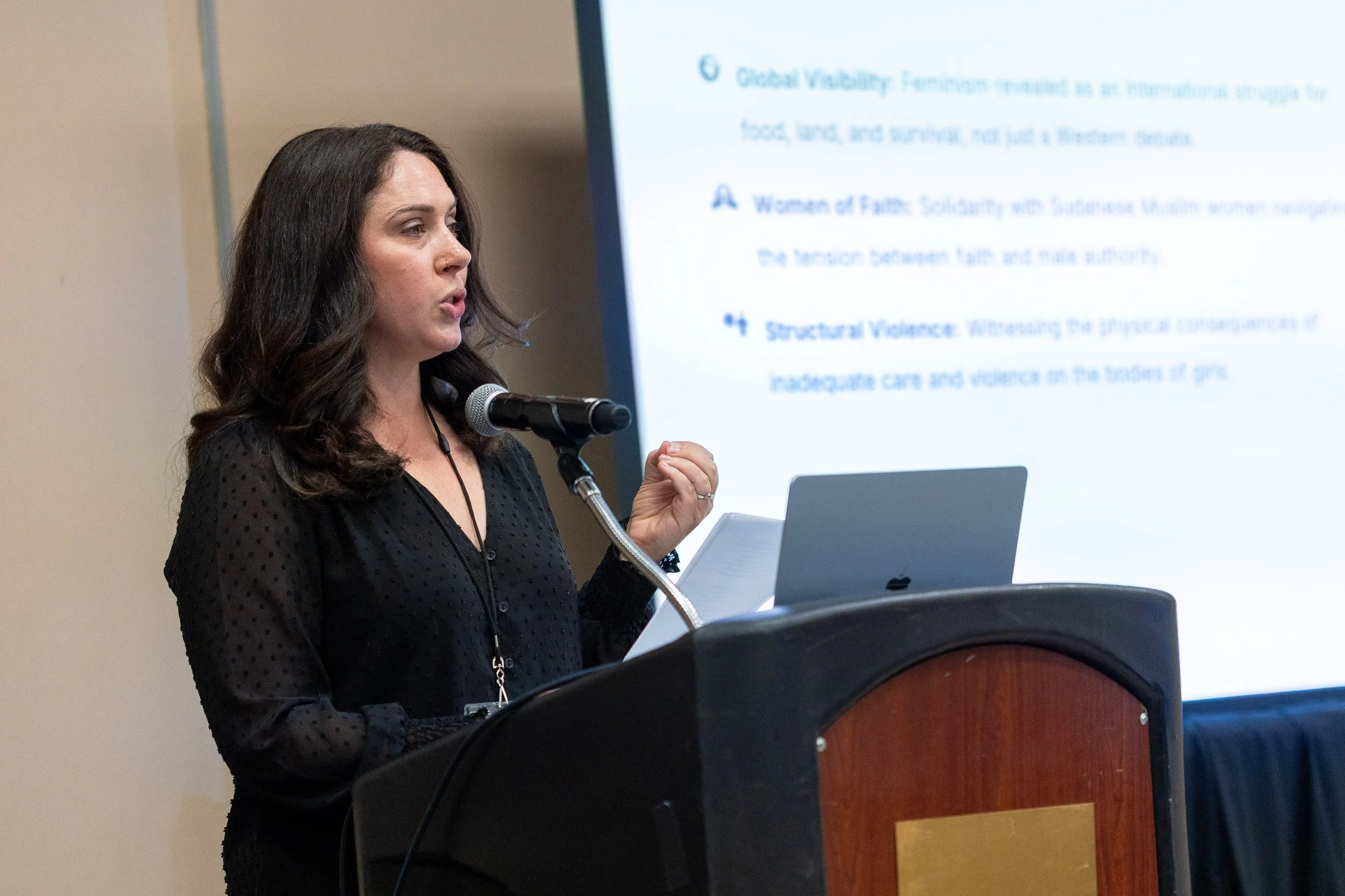 Katie Ludlow Rich speaking at a conference