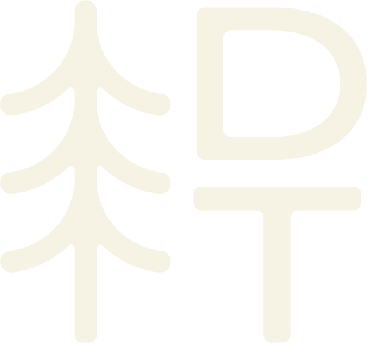 An off-white logo combining a stylized pine tree beside a letter D and letter T, representing Dawson Trails