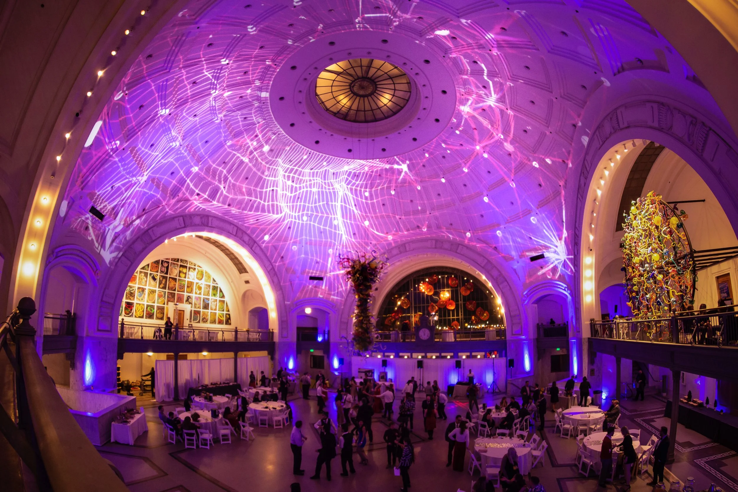 Tacoma Union Station projection mapping in Tacoma, Washington, wide view of the lit rotunda over an event