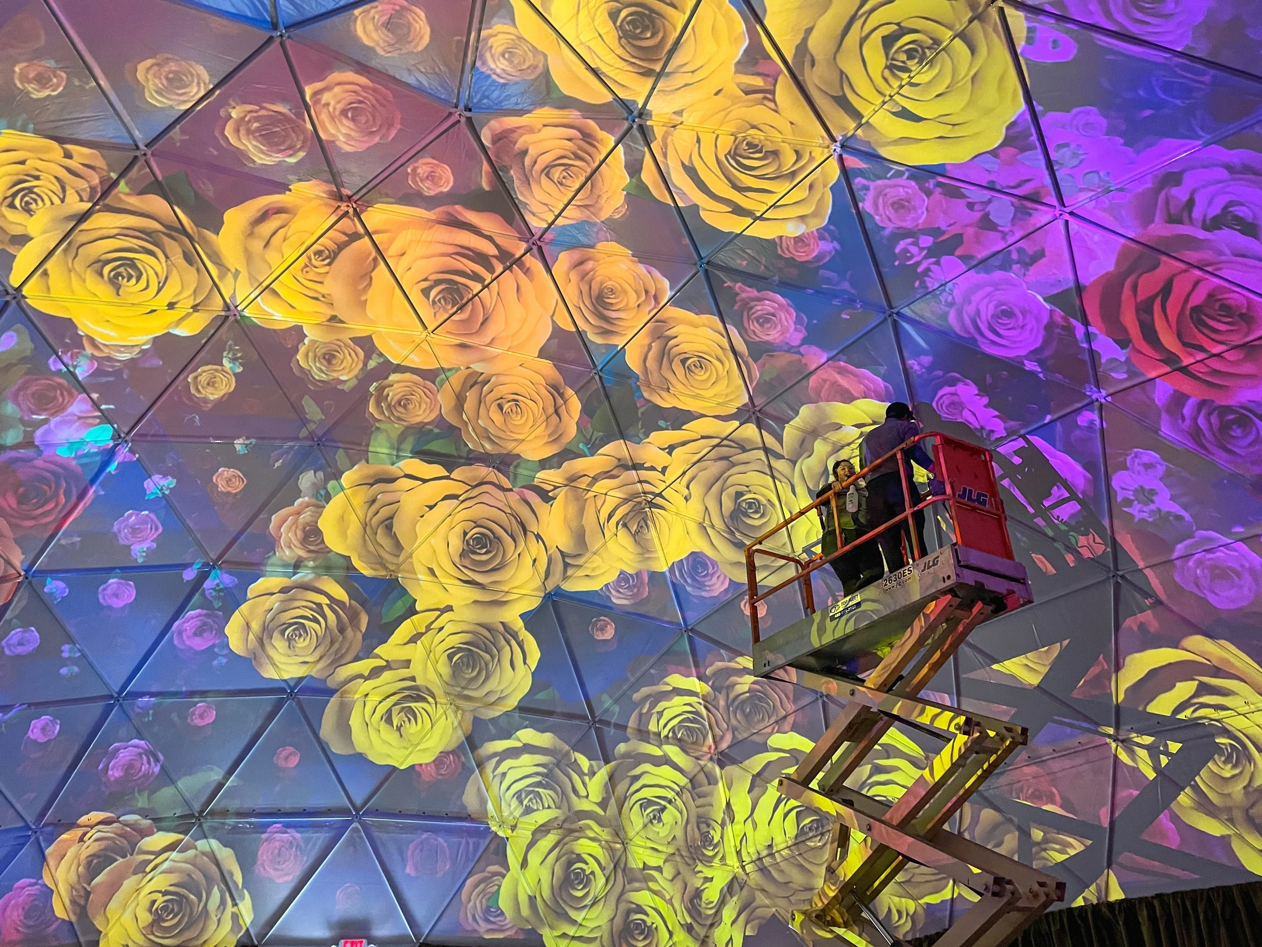 Villa Fleur dome projection system at Desert Ridge Marketplace, lift crew commissioning the mapped rose ceiling