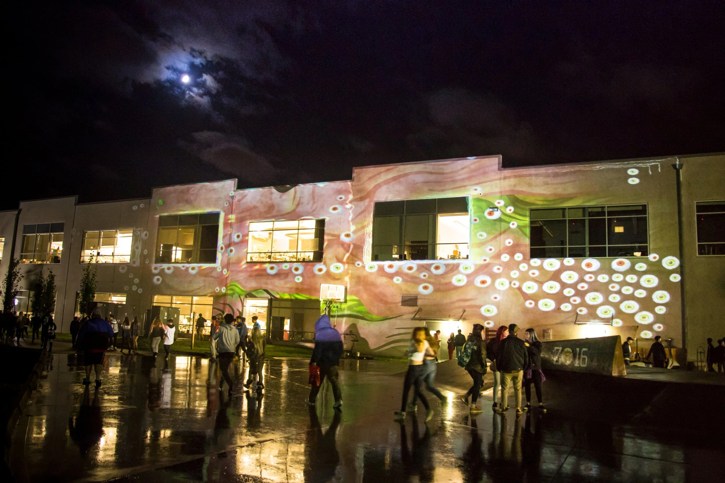 Custom skate inspired projection mapping visuals by NOVA Light Labs cover the Zumiez headquarters facade at night during the Best Foot Forward finals in Lynnwood, Washington