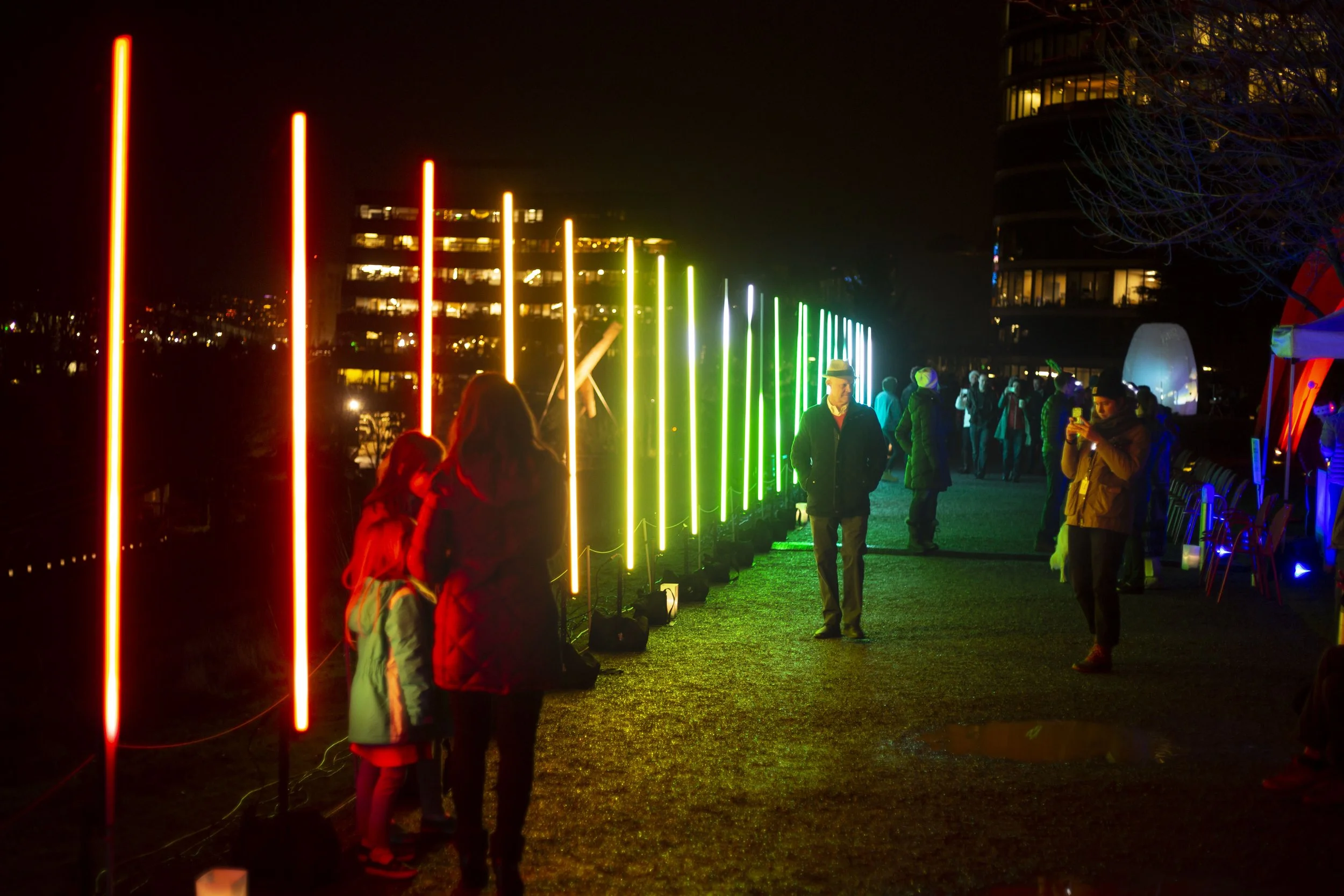 TUBIX Bars lighting installation outdoors, a row of color shifting light rods lining a night path