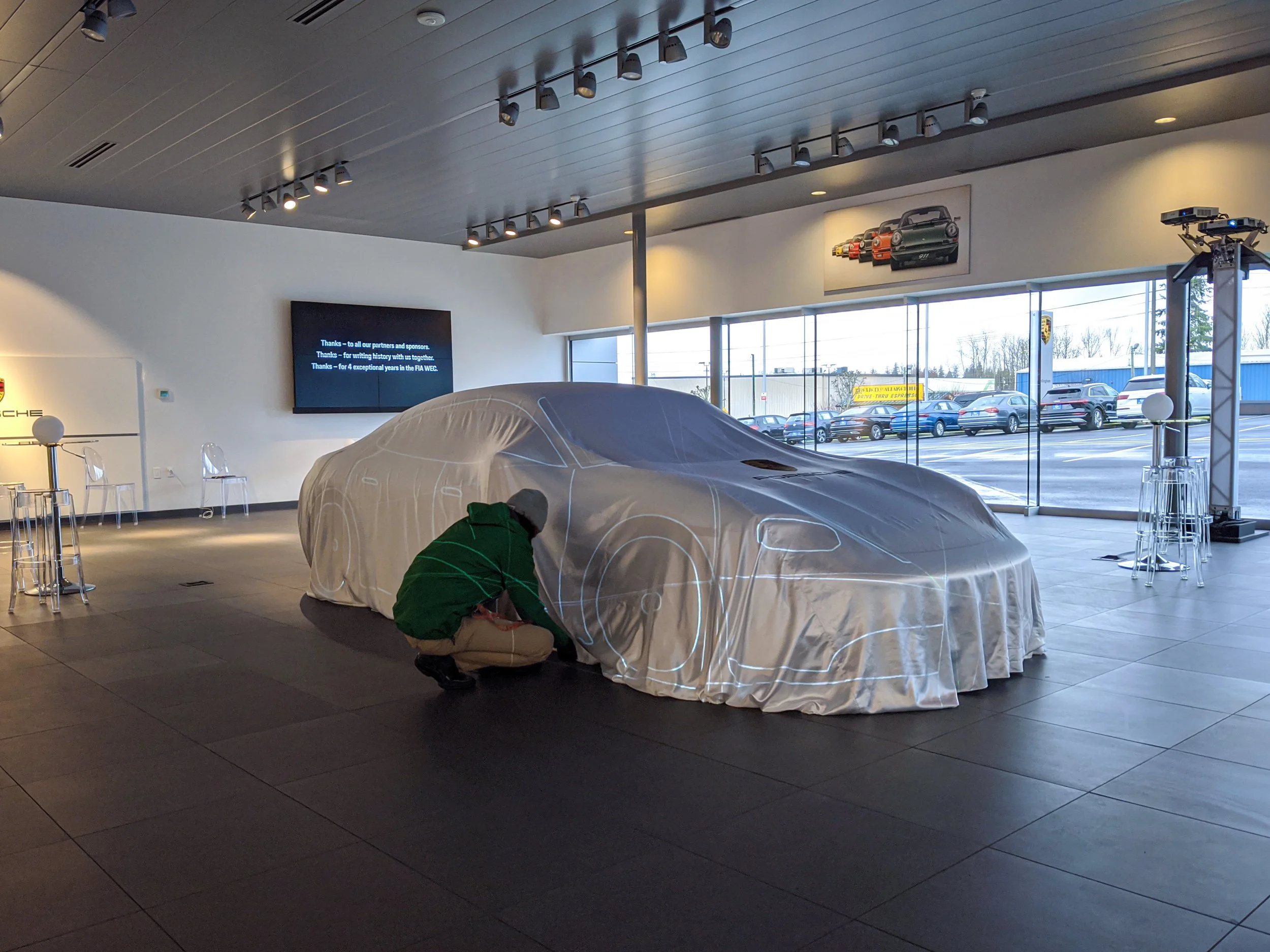 Porsche Taycan unveil projection mapping setup in Bellingham, Washington, veiled car during alignment