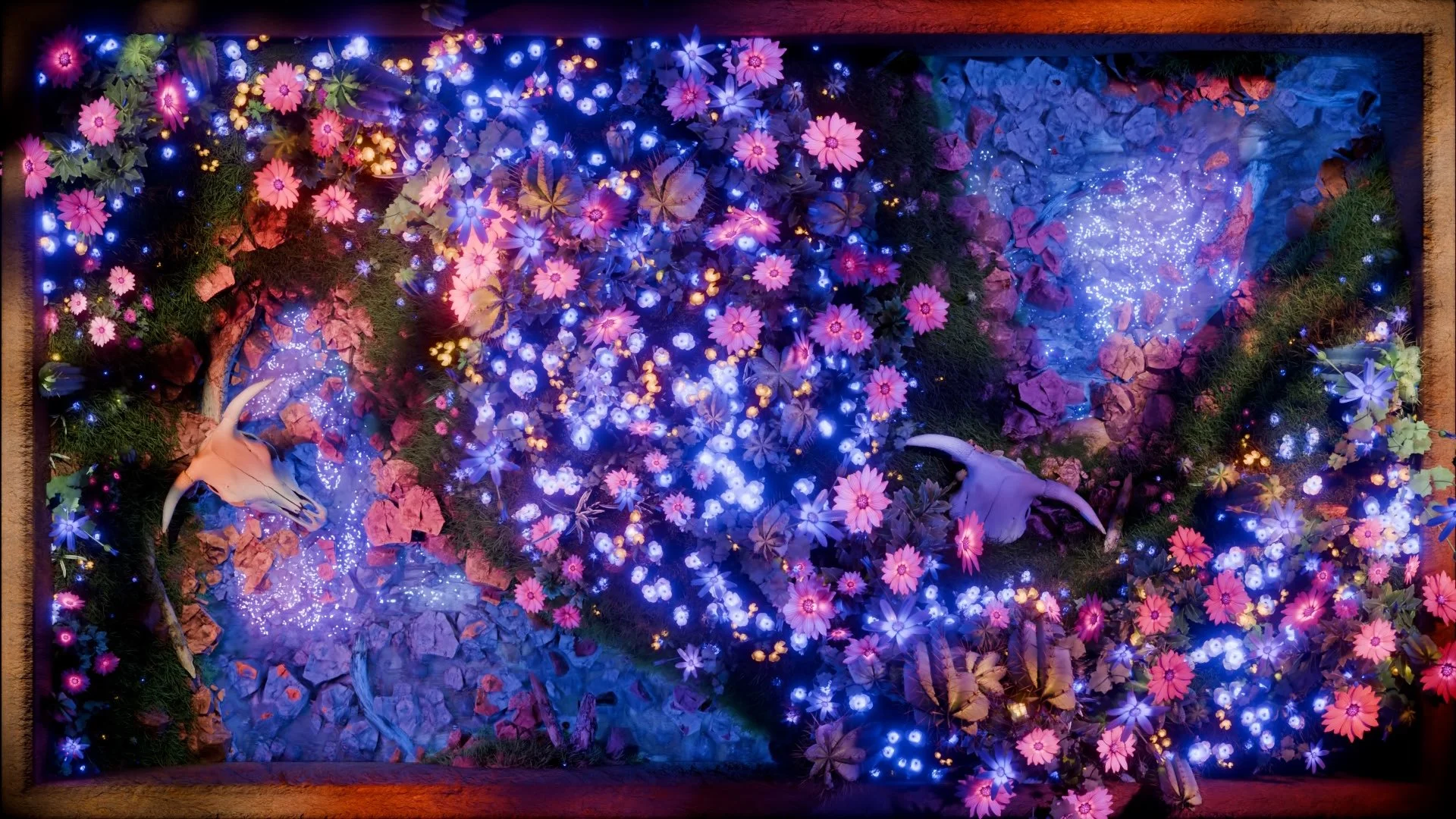 Detail of the spring desert landscape at Idle Hands Phoenix, glowing blooms over rock with a pale skull and teal basin