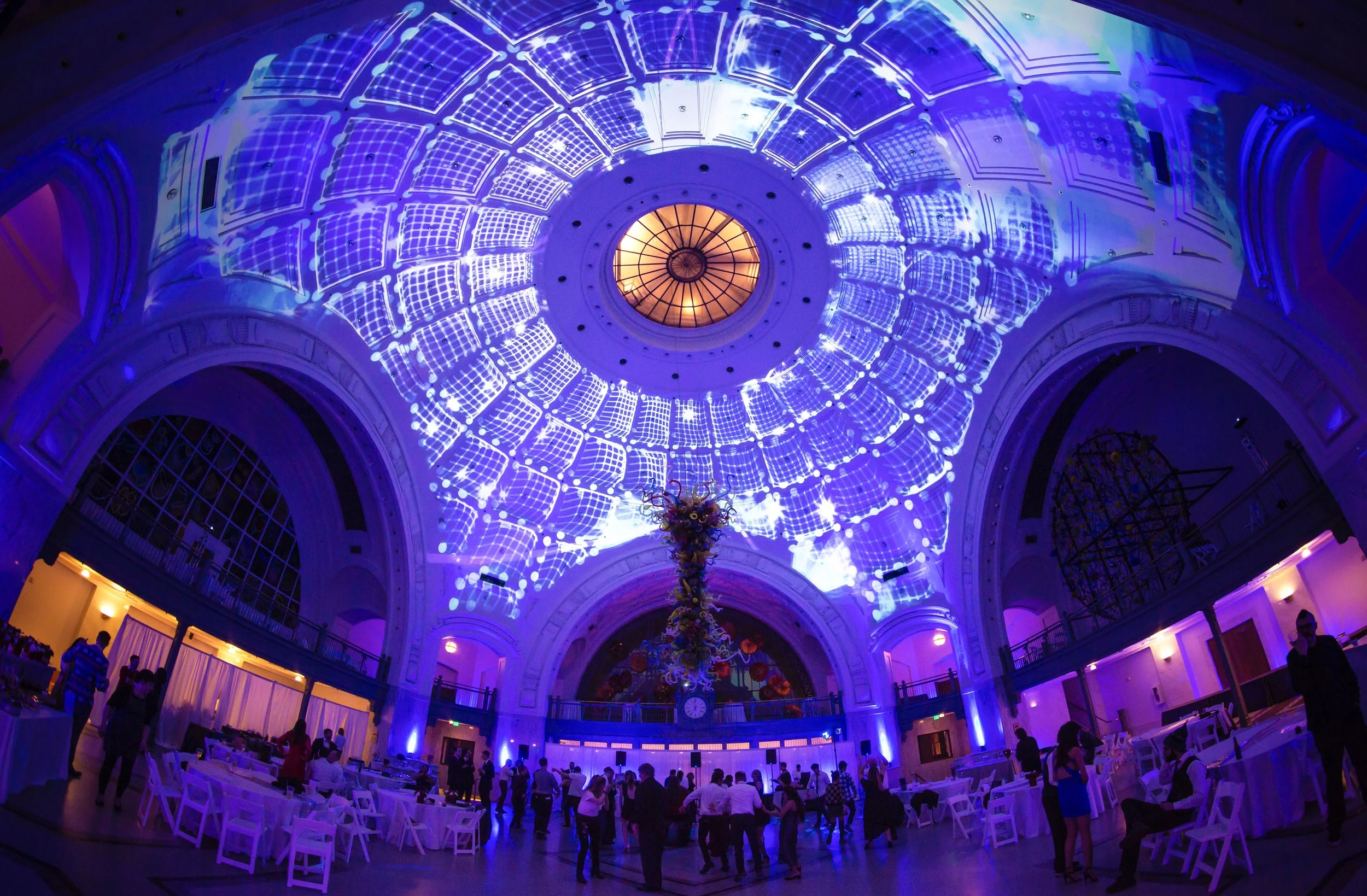 Tacoma Union Station dome projection mapping in Tacoma, Washington, blue lit rotunda over an event
