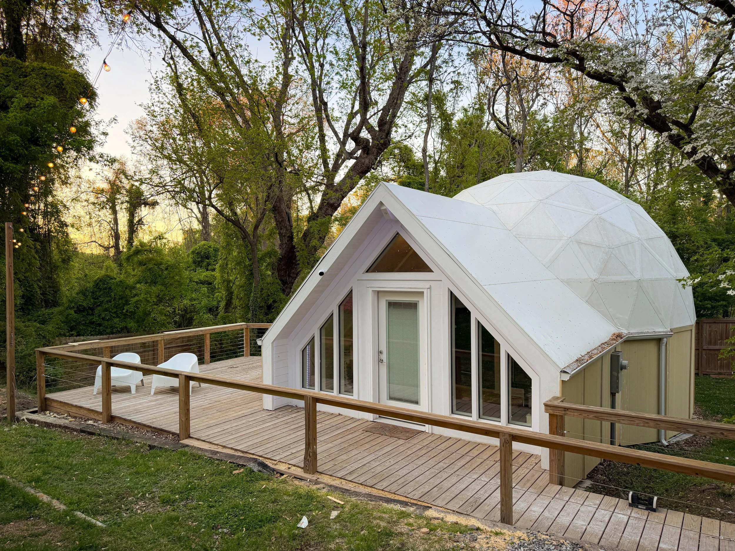 The Chromadome projection dome in Winston-Salem, North Carolina, exterior at dusk with deck and string lights.