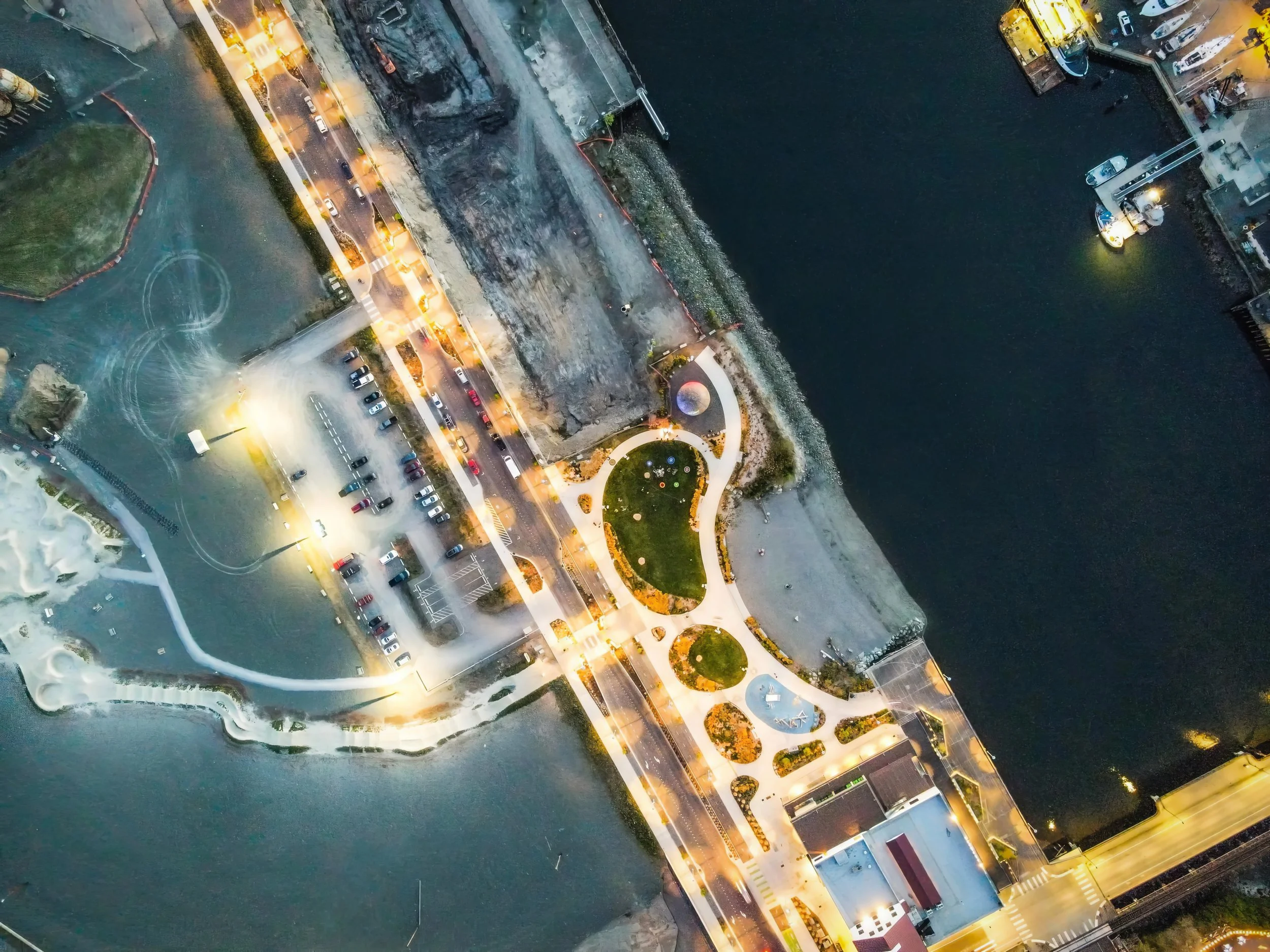 Bellingham Acid Ball projection mapping at Waypoint Park, overhead aerial of the waterfront site at night