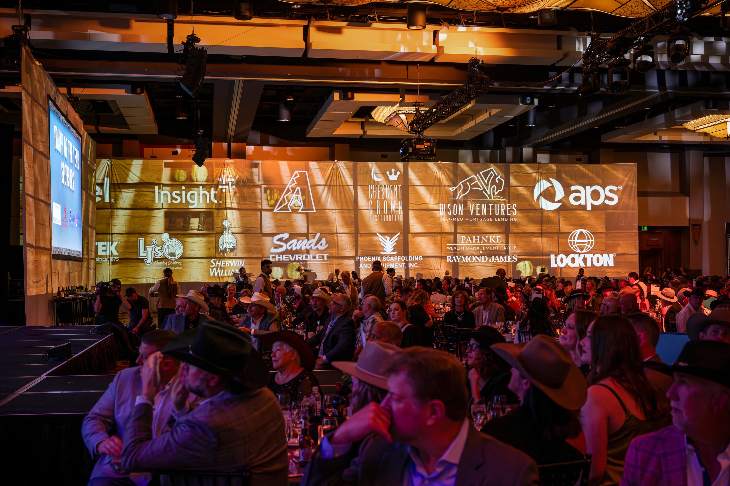 Boys & Girls Clubs Stars Gala projection mapping at the Westin Kierland, sponsor logos above a cowboy hat crowd