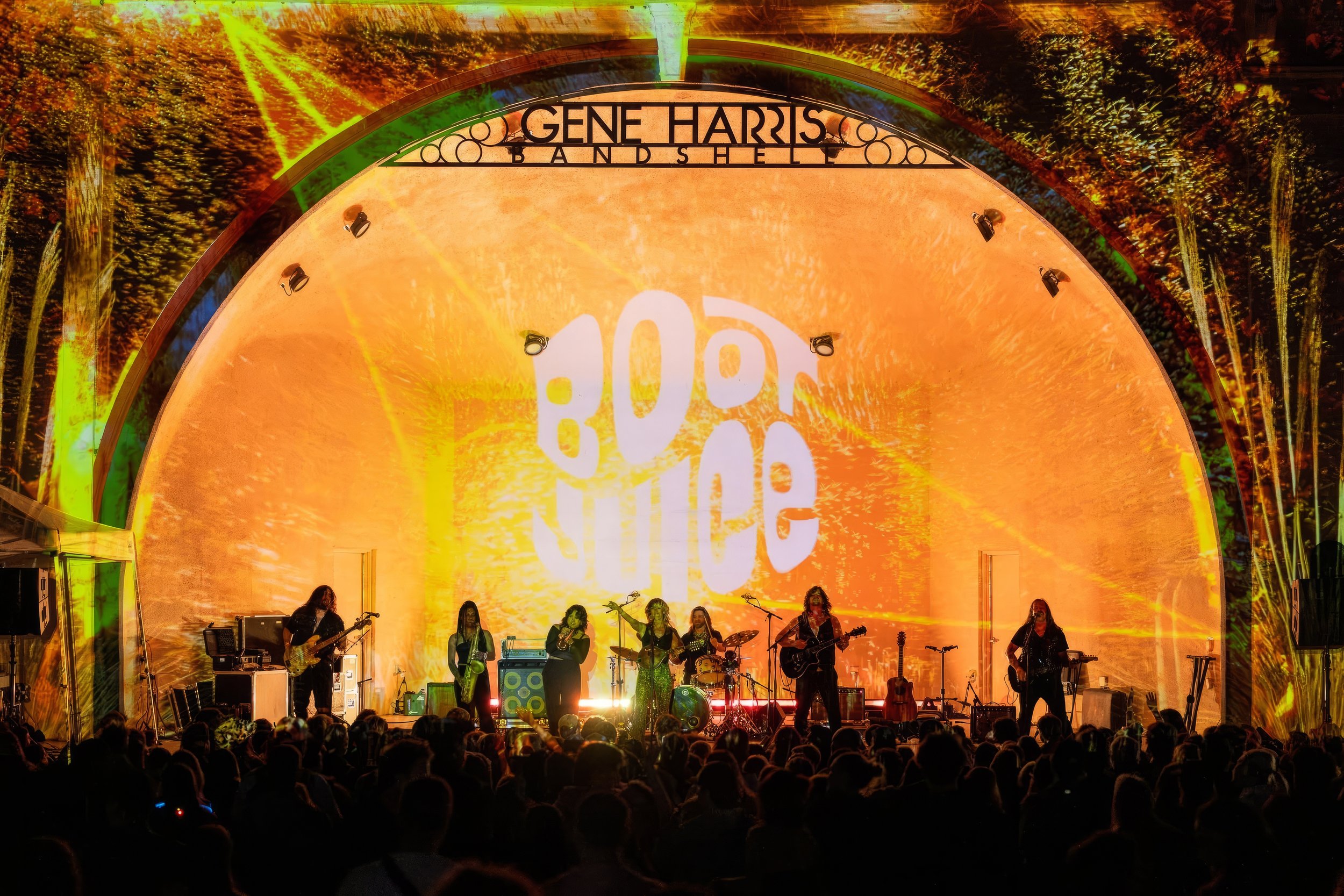Projection mapping on the Gene Harris Bandshell at Treefort Music Fest, Boise, warm surreal plants behind a full band.