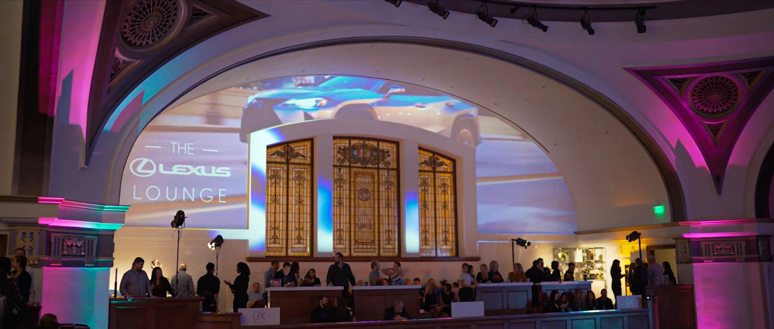 Projection mapping of the Lexus Lounge logo and vehicle films across the arched wall of The Sanctuary in Seattle, Washington