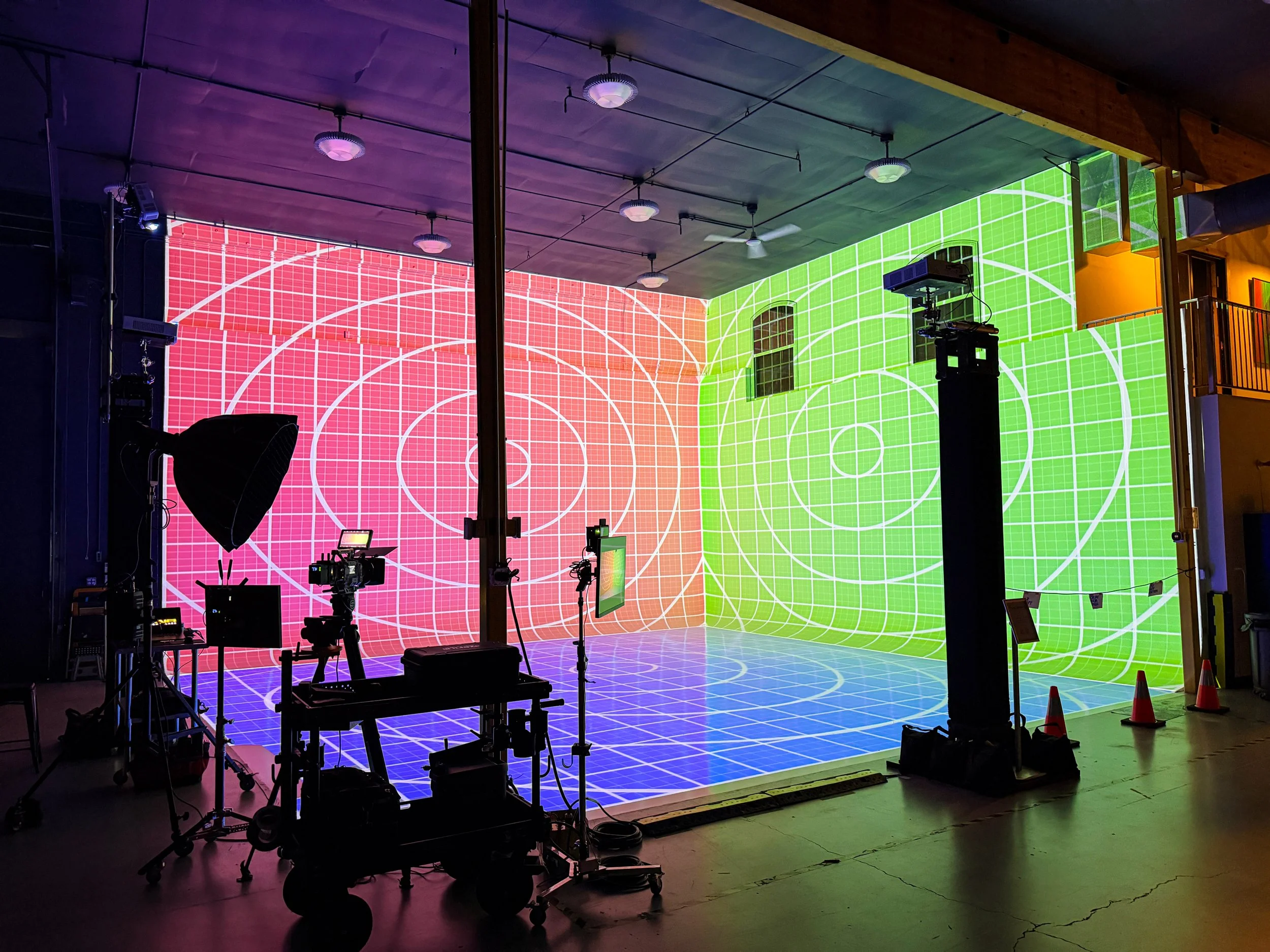 Alignment grid projected across the Visionkit Studio cyclorama in Garden City, Idaho, with camera and lighting rigs set