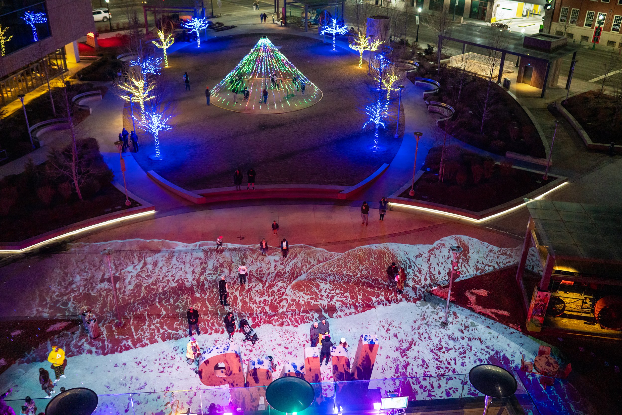 ILLUMIBRATE 2023 projection mapping at JUMP Boise, aerial view over wave lit plaza and light cone