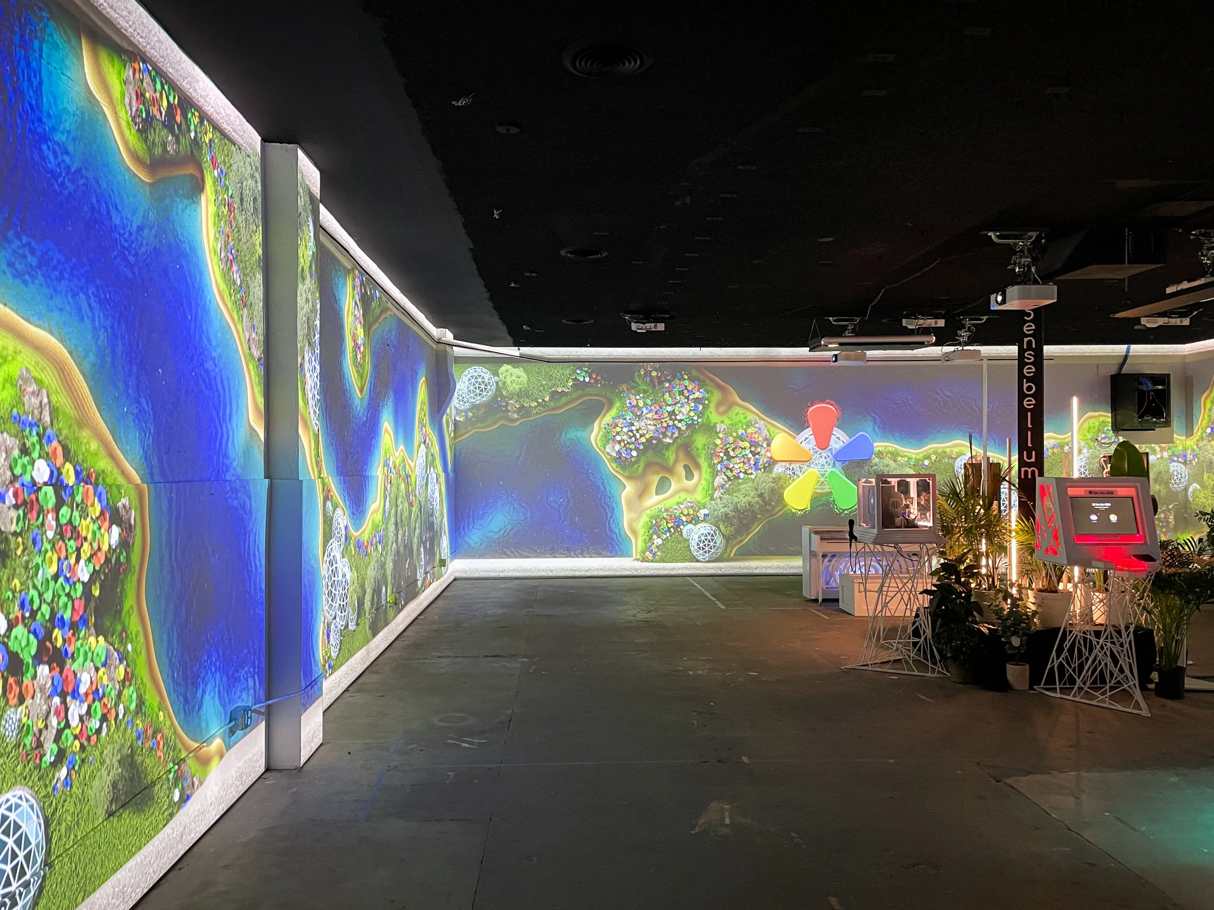 JUMP ILLUMIBRATE 2024 immersive projection room, custom visuals wrapping the walls beside interactive kiosks