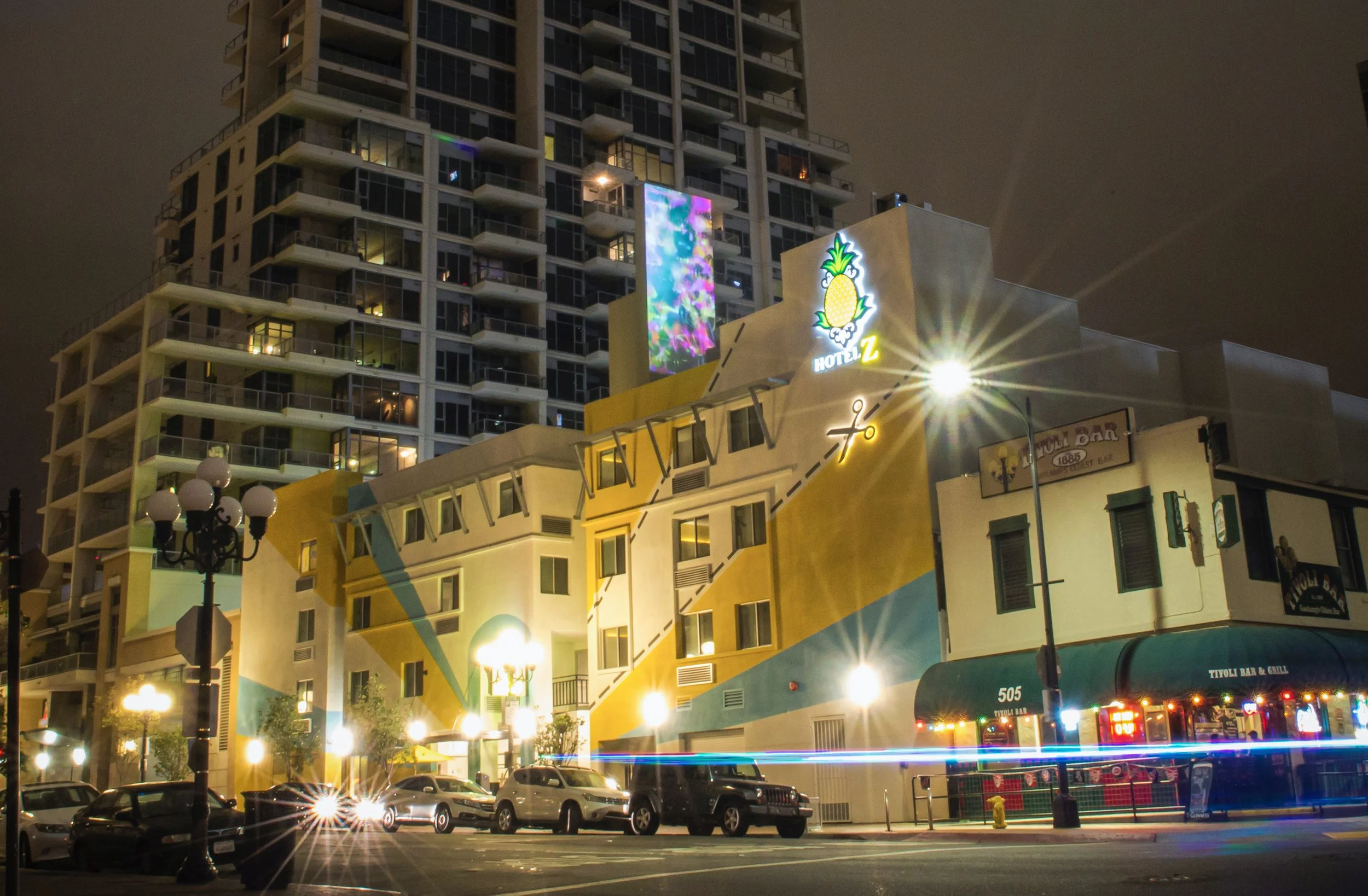 Hotel Z projection mapping in San Diego Gaslamp Quarter, full facade lit with light trails on the street