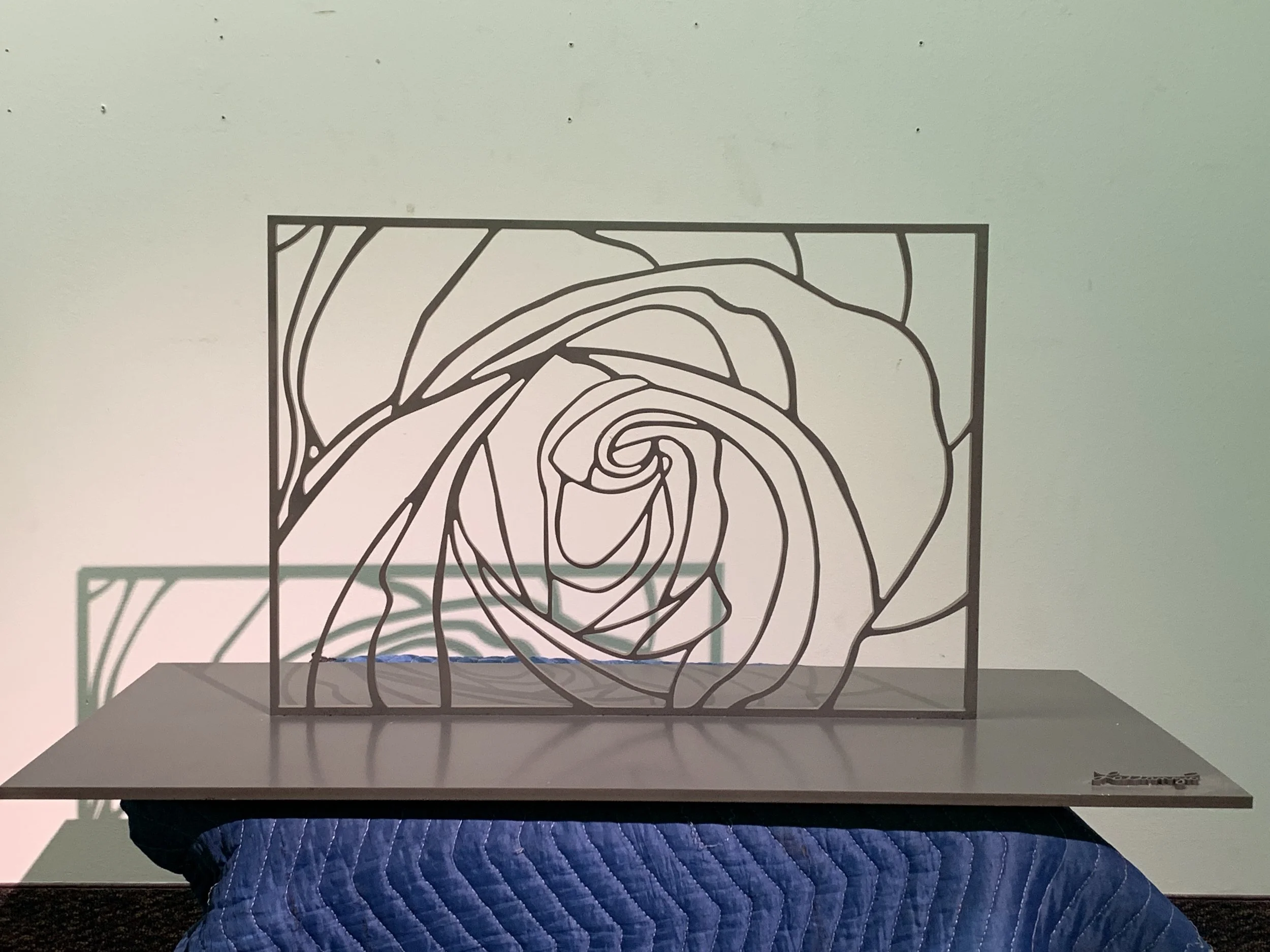 Rose 
Look Inside
carved metal on metal base, paint
16 x24 x 3/8 inch on 36 x 18 x1/2 inch base