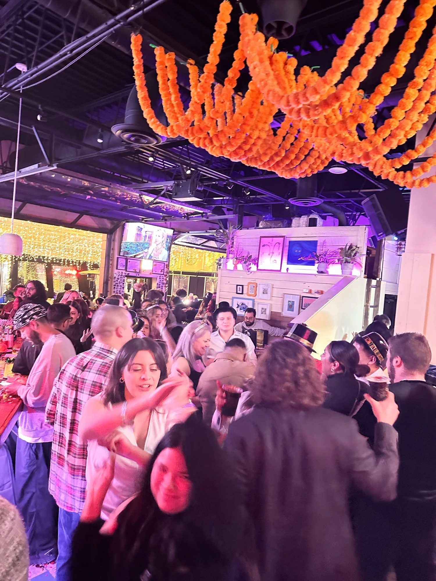 Crowd with marigolds at Diego