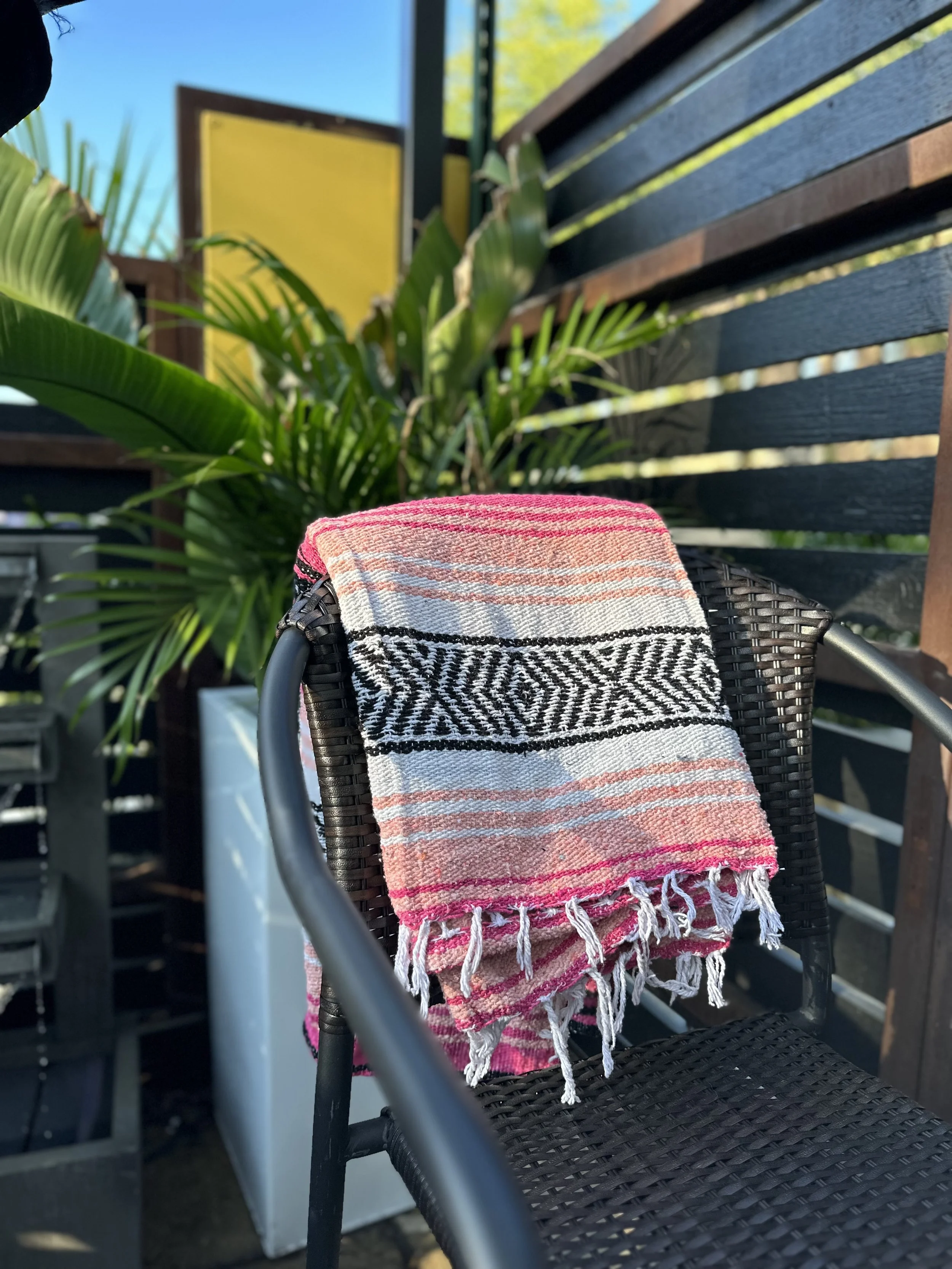 Guest with a blanket on the Diego patio