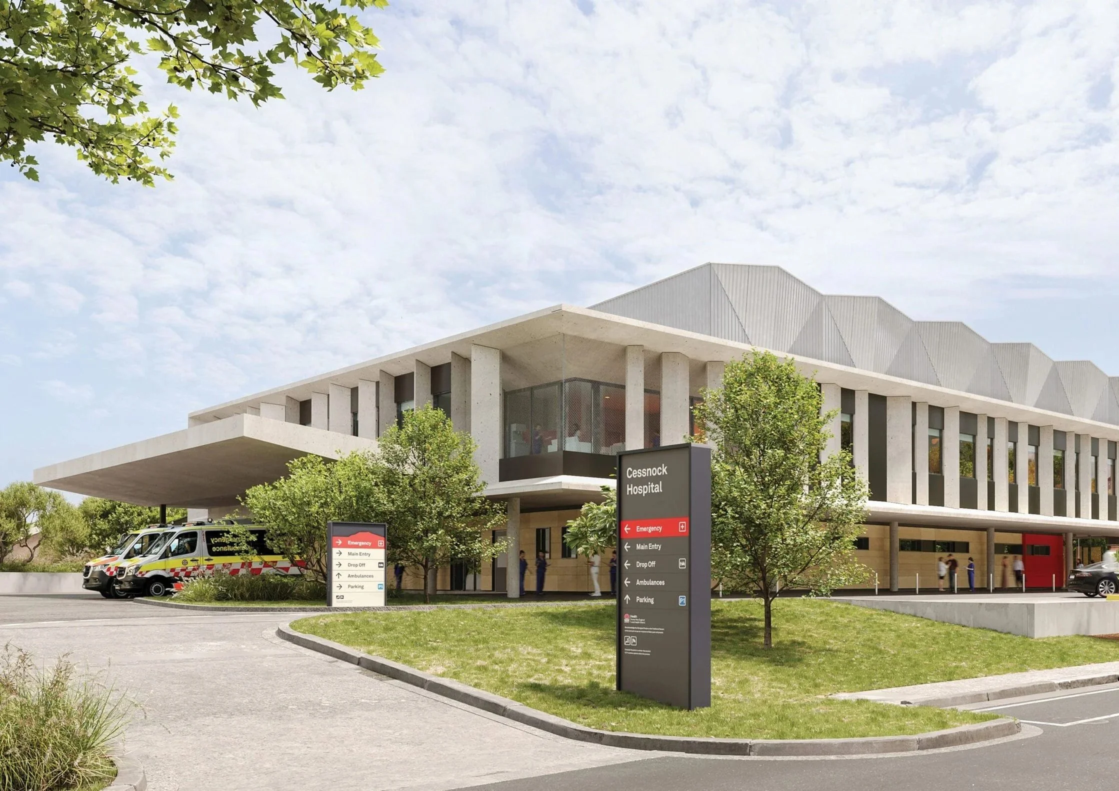 Exterior view of Cessnock Hospital with signage indicating emergency, main entry, drop off, ambulances, and parking. Ambulances are parked outside, and several people are near the entrance. Trees and a partly cloudy sky are visible.
