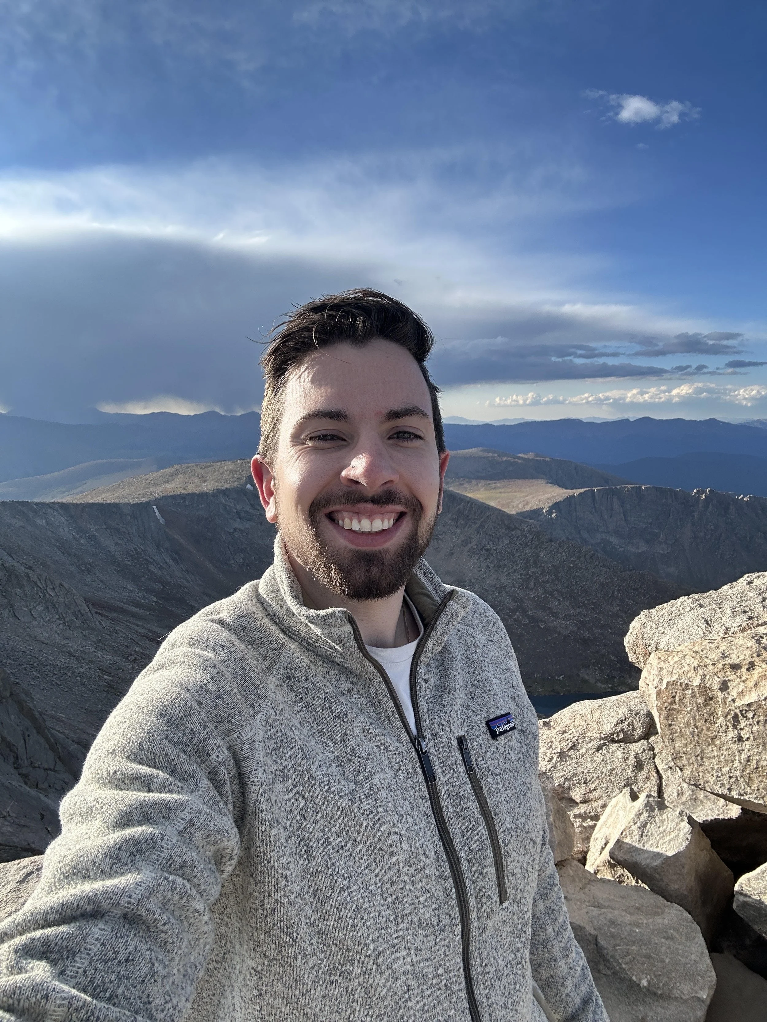 Dr. Goulet, associate veterinarian at Pawlyclinic, enjoying a mountain hike — providing compassionate veterinary care to pets across the Denver area