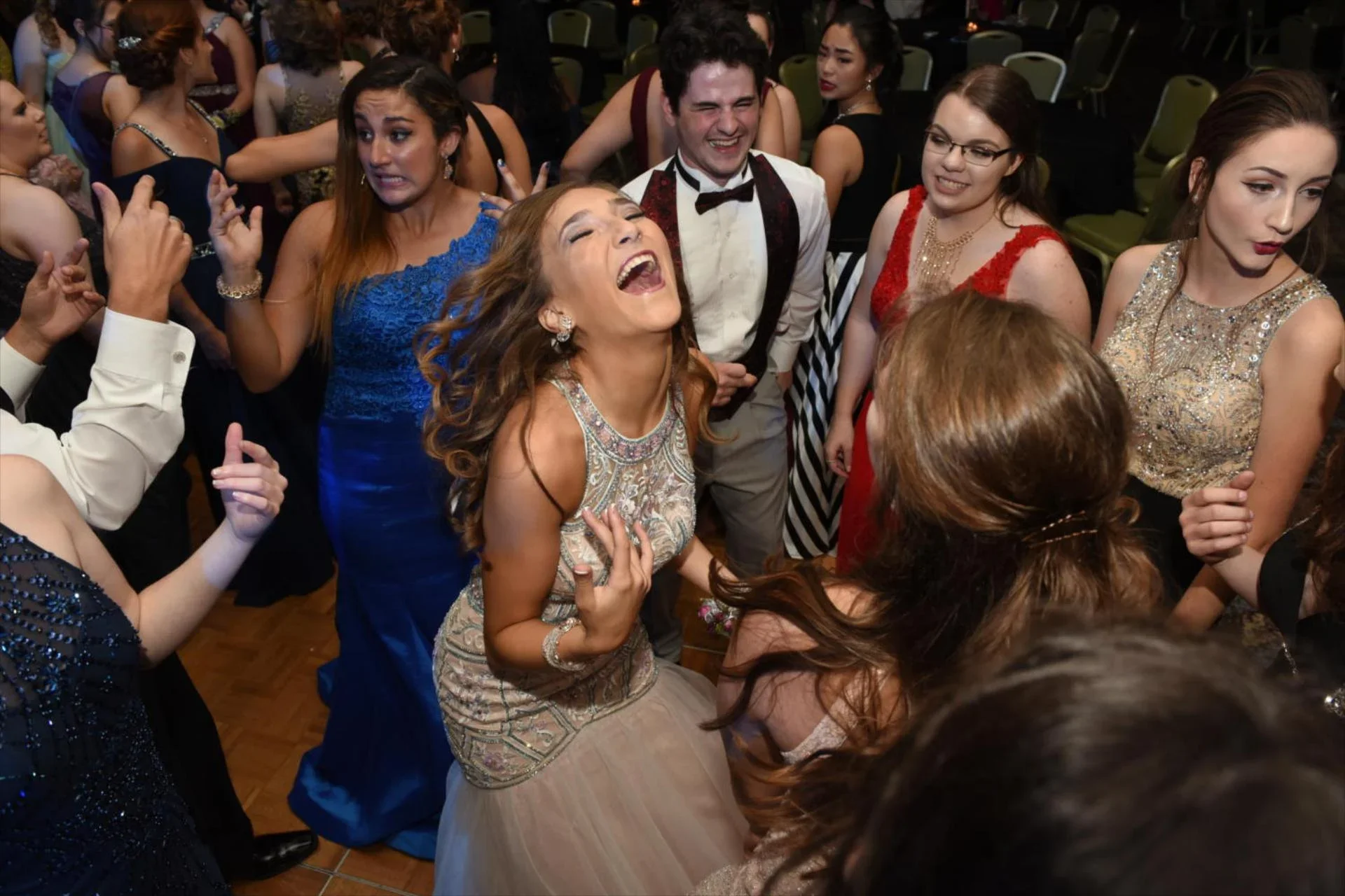 Students dancing and celebrating at a formal event or party with sound and lighting provided by Good Times Events & Entertainment.