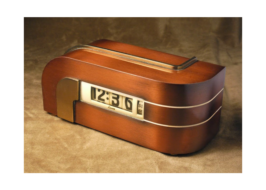 A vintage wooden flip clock showing the time as 12:36.