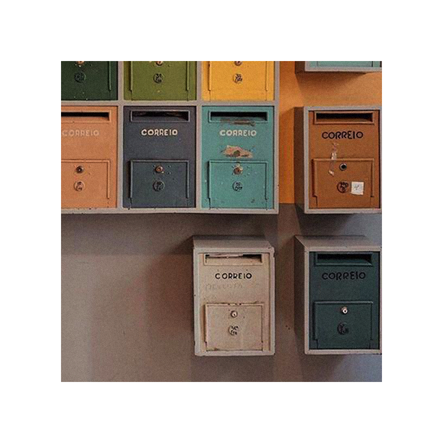 Colorful mailboxes on a wall, each labeled "Correio," in various colors including green, yellow, orange, blue, and white.