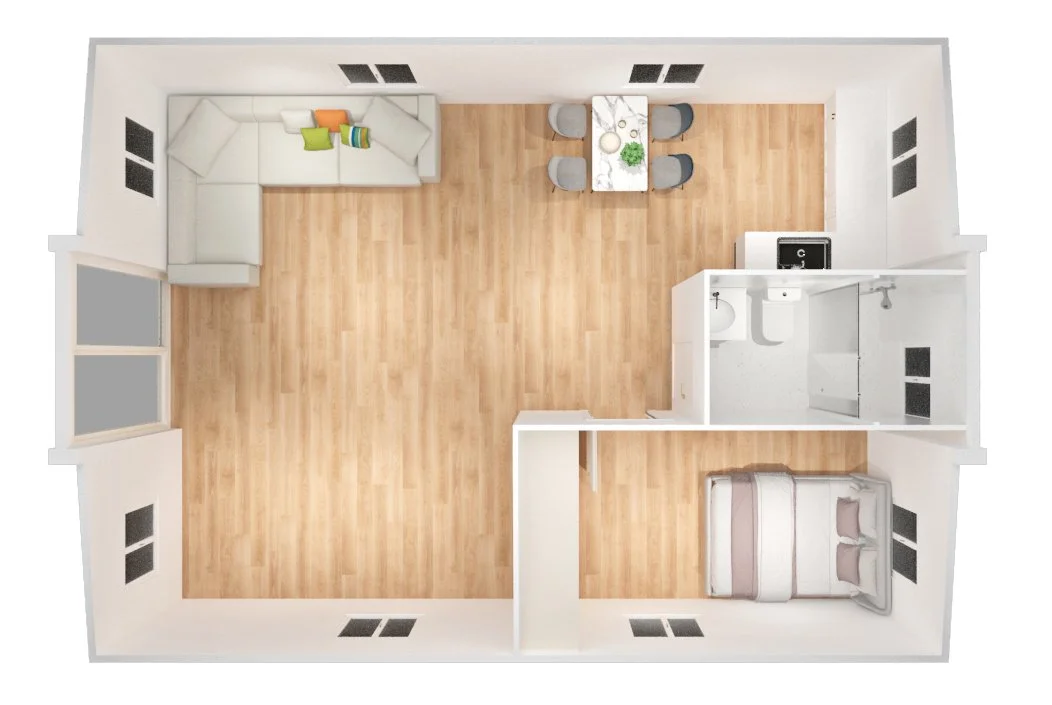 Top-down view of a studio apartment with a sitting area, a dining table with four chairs, a bedroom with a bed, and a small bathroom with a toilet, sink, and shower.