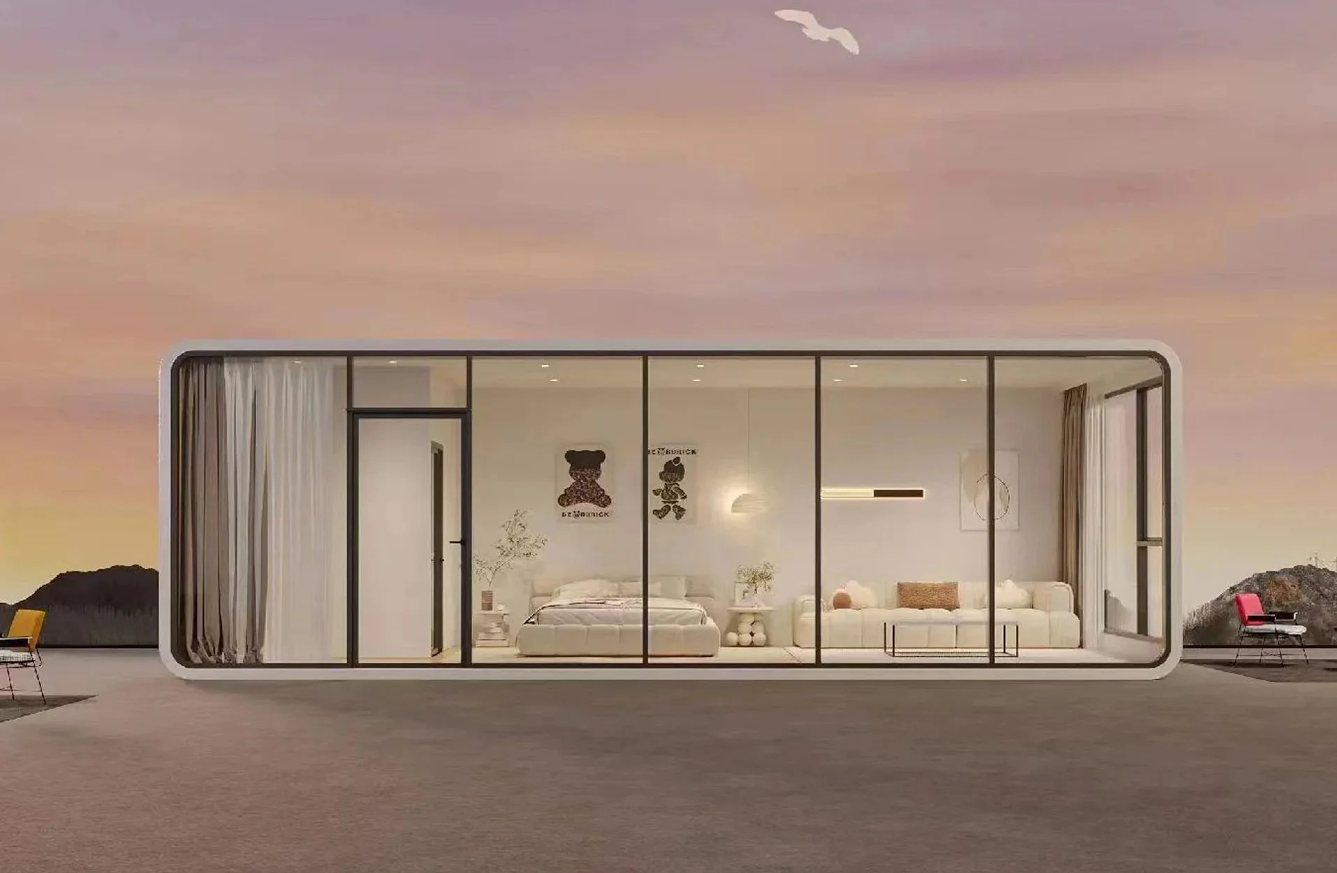 A modern tiny house with large glass windows and sliding doors, showing a minimalist interior with a bed, sofa, and artwork, set against a pastel-colored sunset sky.