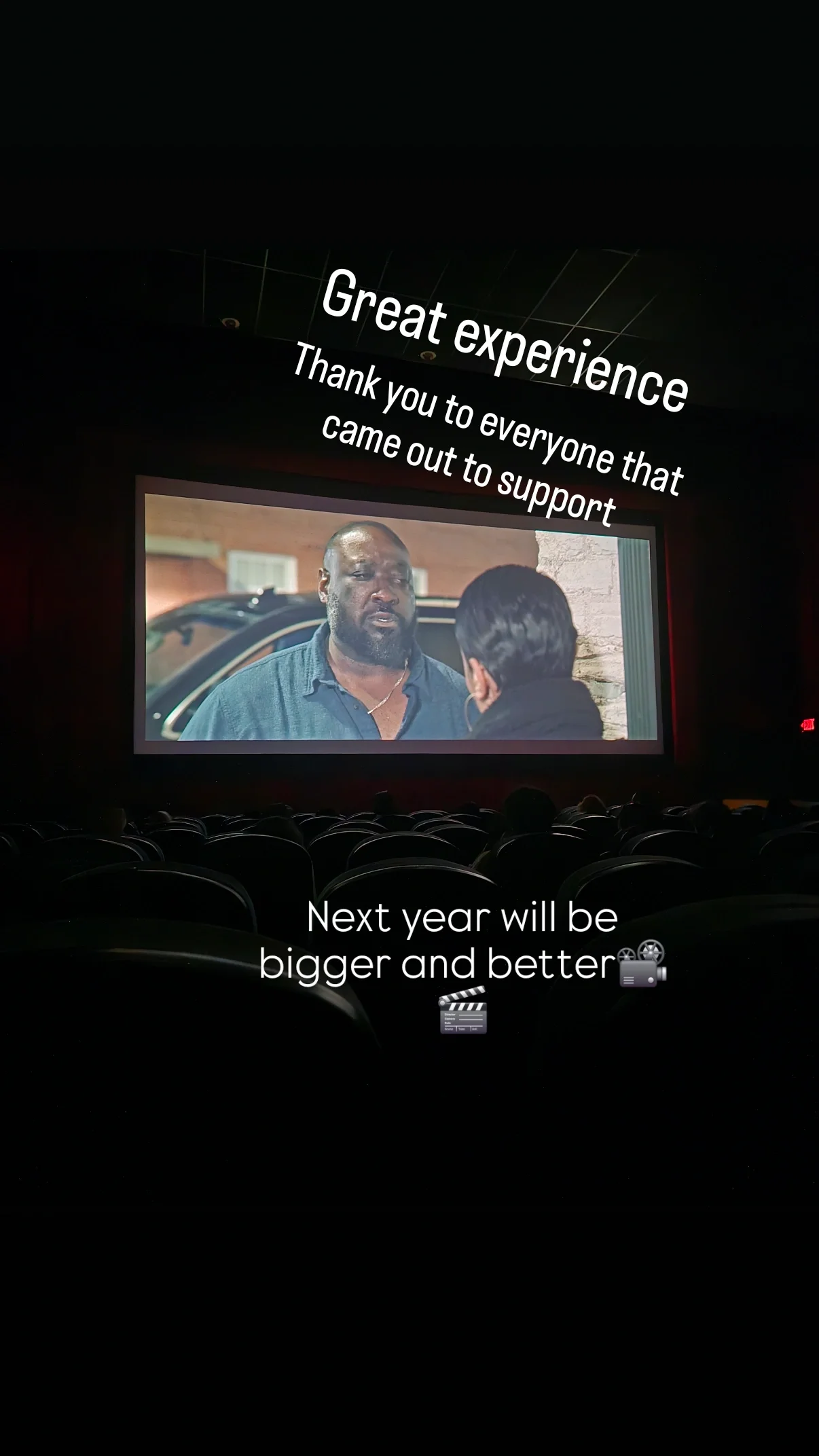 Audience watching a movie theater screen with a thank you message for support, showing a scene from a film with two characters, and the text "Great experience" and "Next year will be bigger and better."