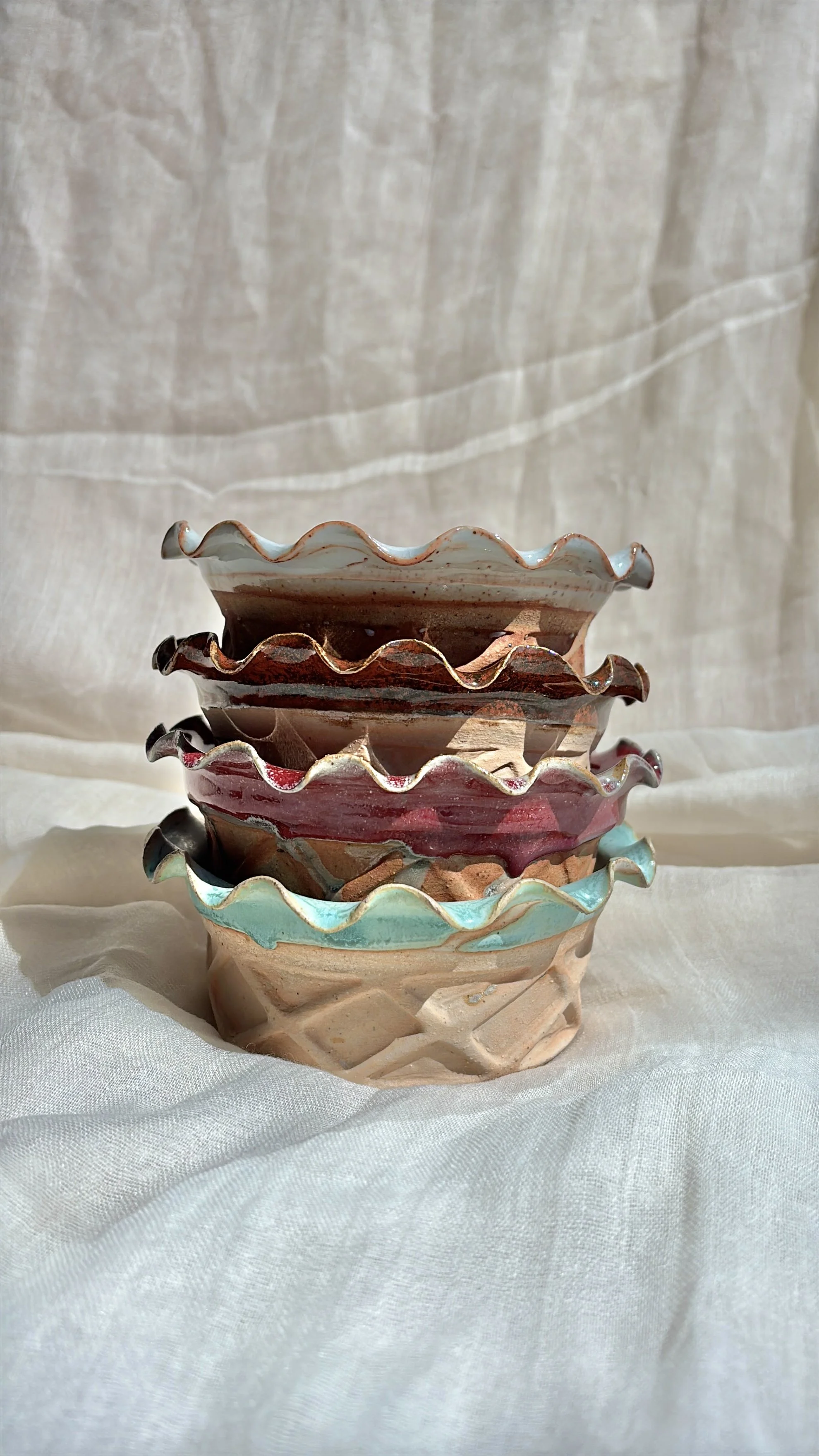 Stack of handmade ceramic waffle cup ice cream bowls in salted caramel, strawberry, and mint.jpg