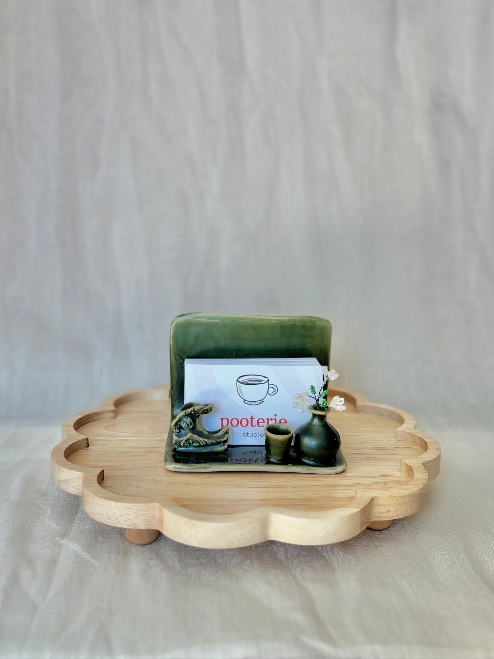 ceramic-business-card-holder-green-wave-sculpted-elements.png