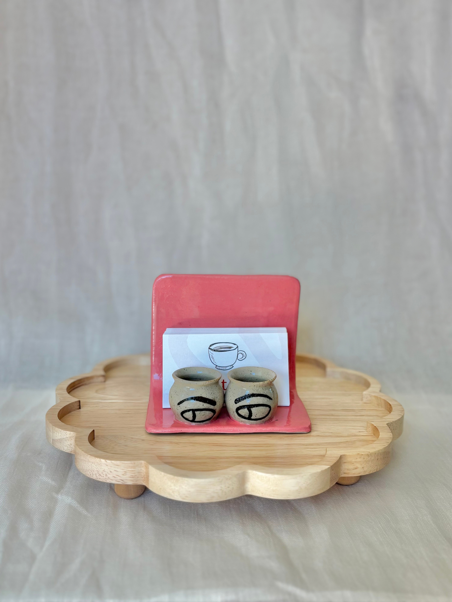 custom-ceramic-business-card-holder-pink-hand-painted-eye-detail.png