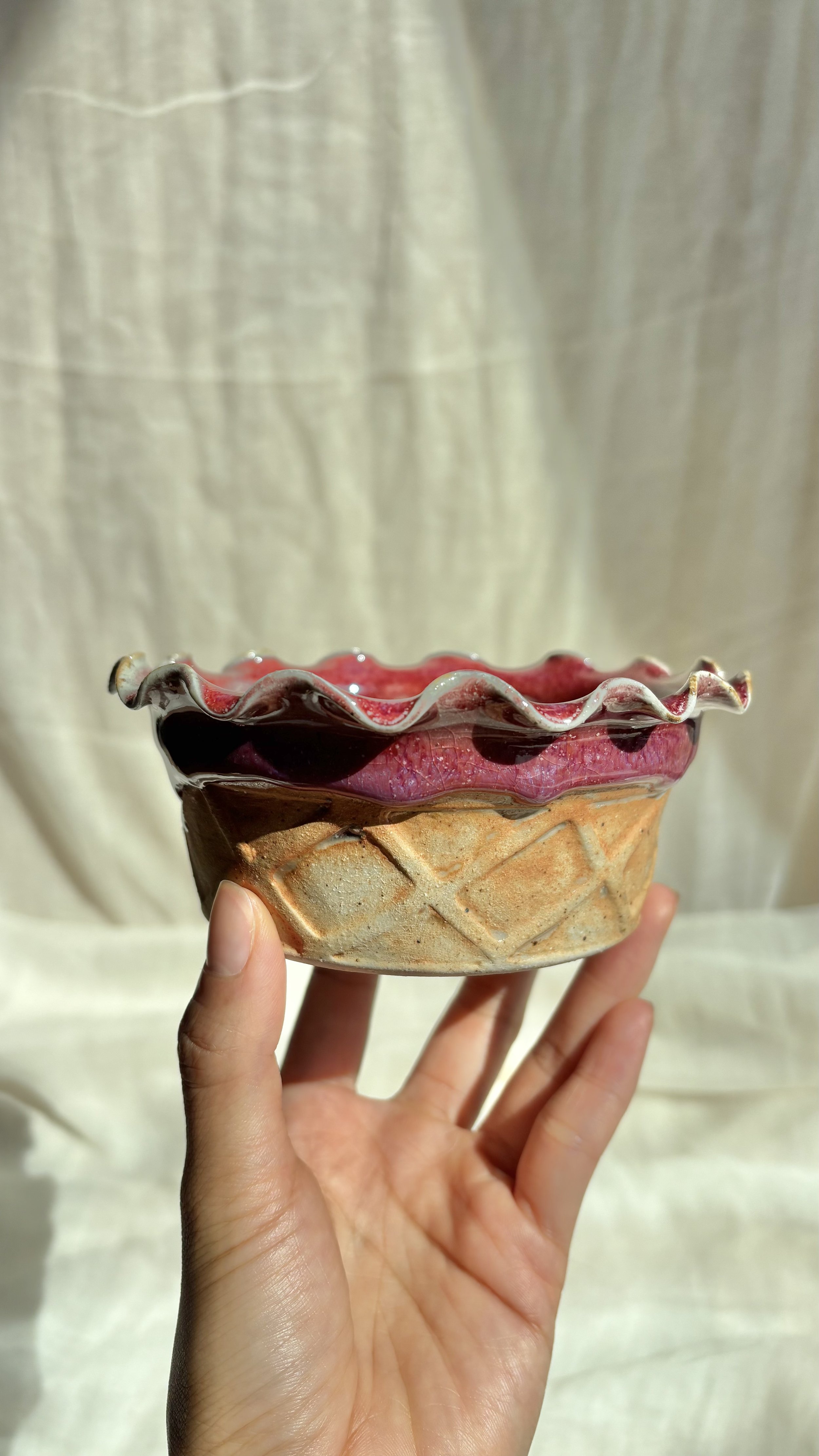 Handmade ceramic waffle cone ice cream bowls in chocolate brownie and mint on soft linen.jpg
