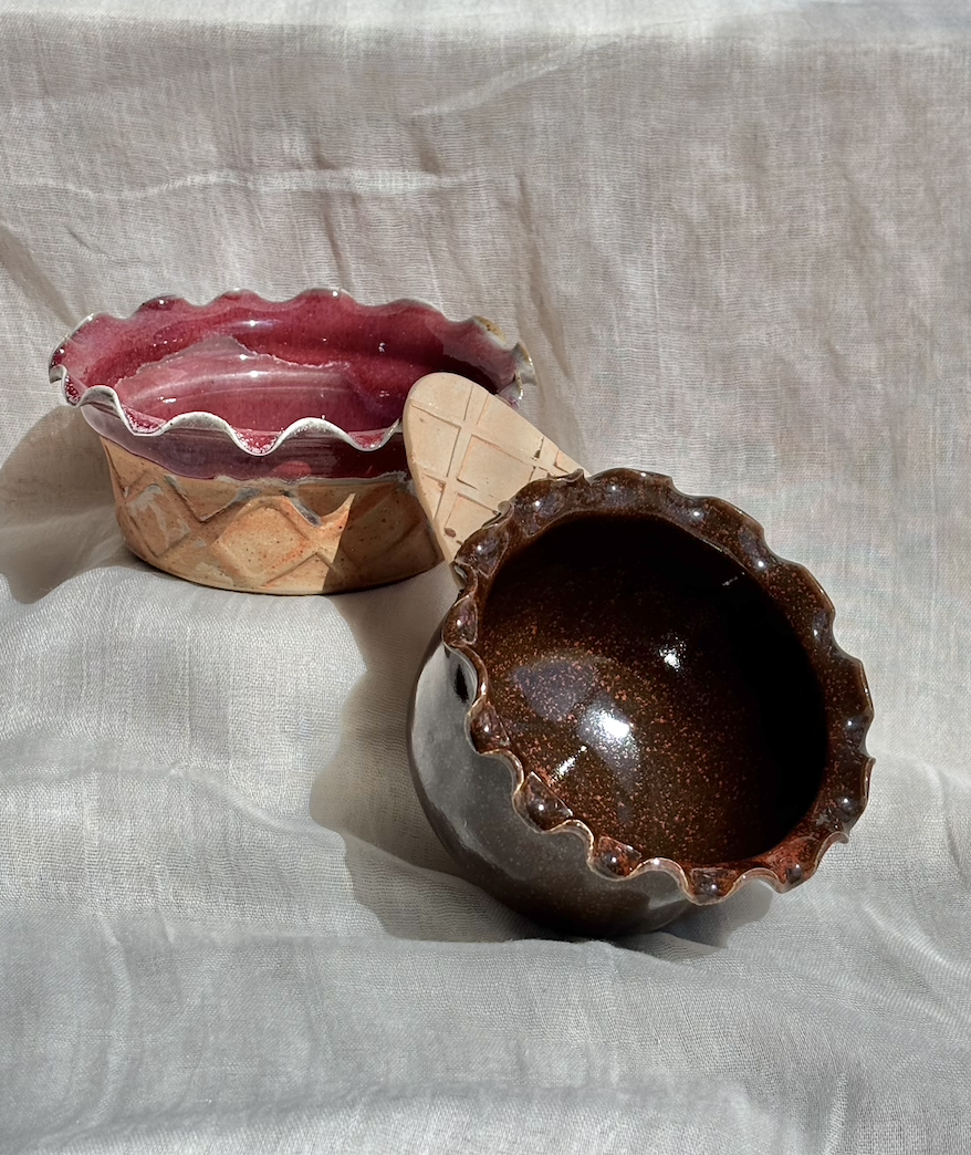 Handmade ceramic strawberry waffle cup and chocolate brownie waffle cone ice cream bowls on linen.png