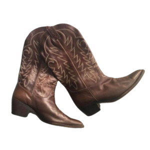 A cowboy boot with brown leather and decorative stitching.