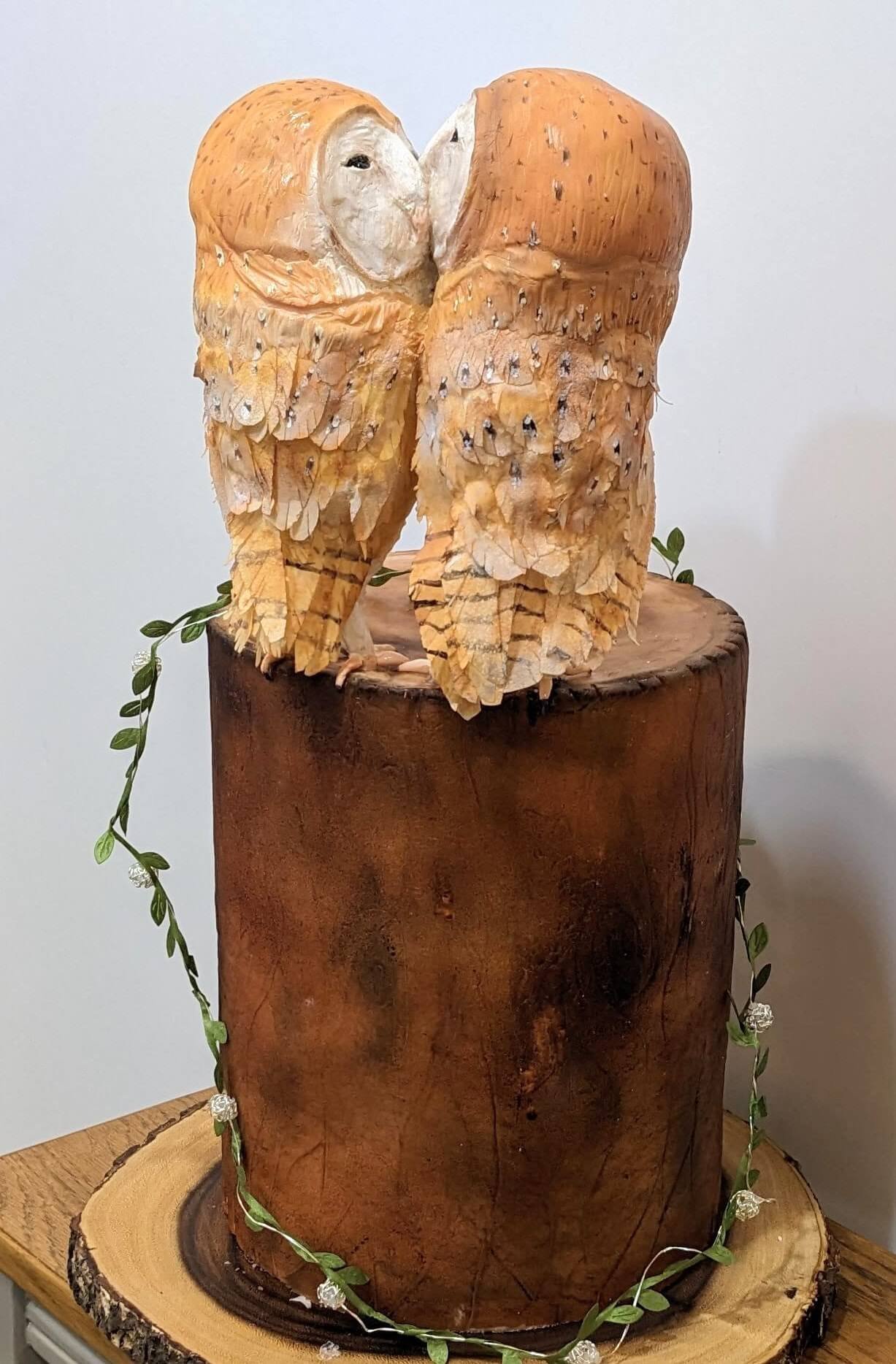Sculpted cake of owls on a tree stump