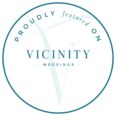 A circular logo for Vicinity Weddings featuring a stylized V and the words "Proudly Featured on" and "Weddings".