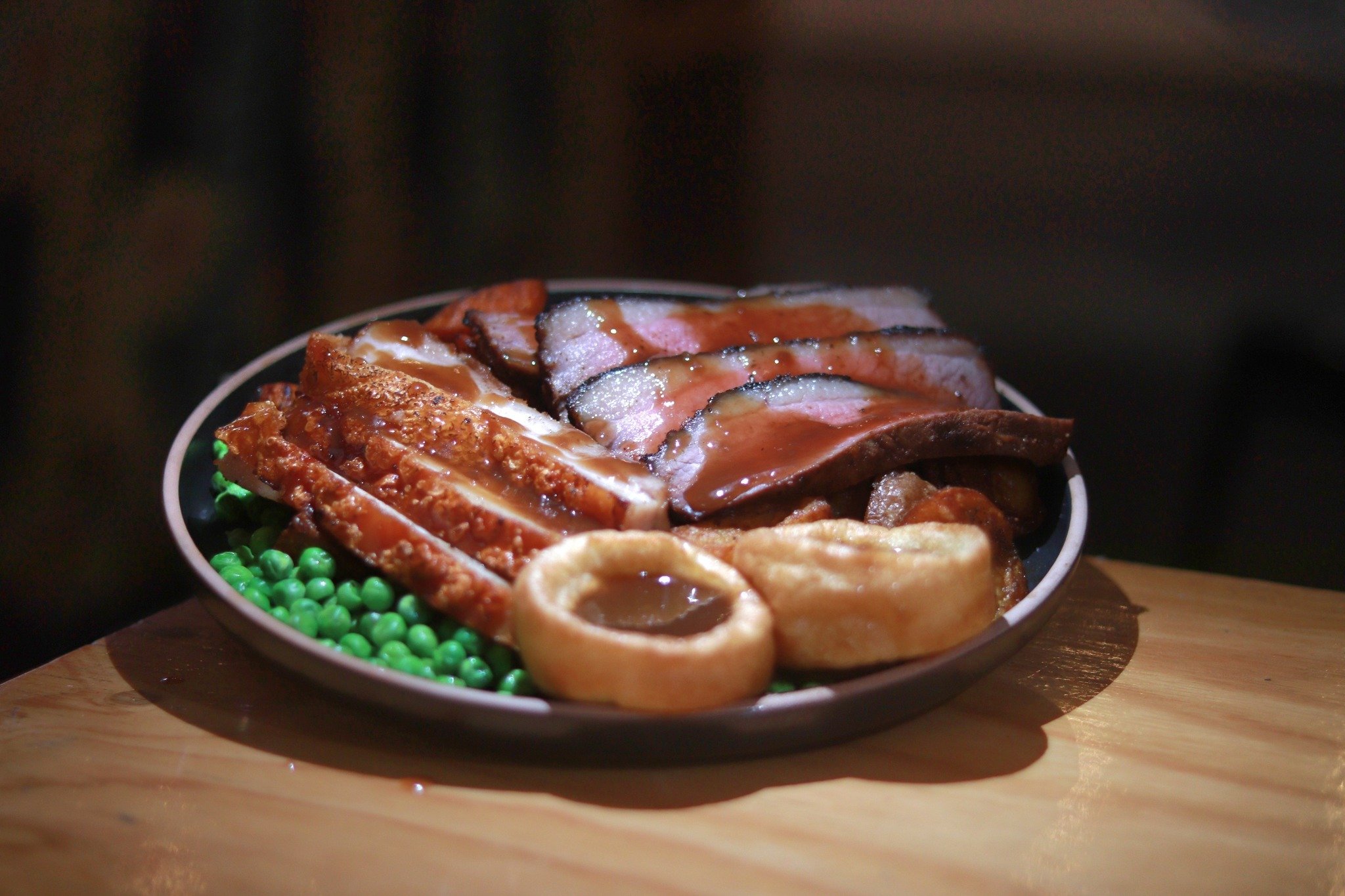 ULTIMATE SUNDAY ROAST
Check out our latest daily deal 🍷

Crispy crackled pork belly and slow roasted dry-rubbed beef brisket with golden potatoes, garden peas, glazed carrots and fluffy Yorkshire pudding, served with a generous pour of housemade gra