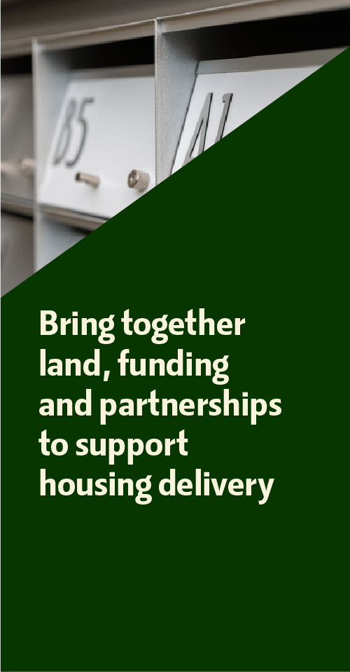 Text overlay on a green background reading, 'Bring together land, funding and partnerships to support housing delivery,' with a blurred image of postal mailboxes in the background.