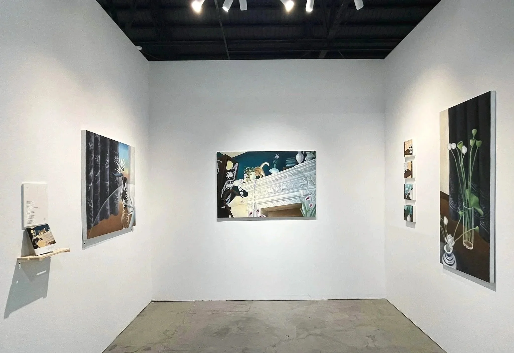 Tsai Yu-Chen's works
An art gallery room with white walls, displaying four paintings. The paintings depict various scenes with floral and architectural elements. The floor is unfinished concrete, and the ceiling is painted black with visible beams.