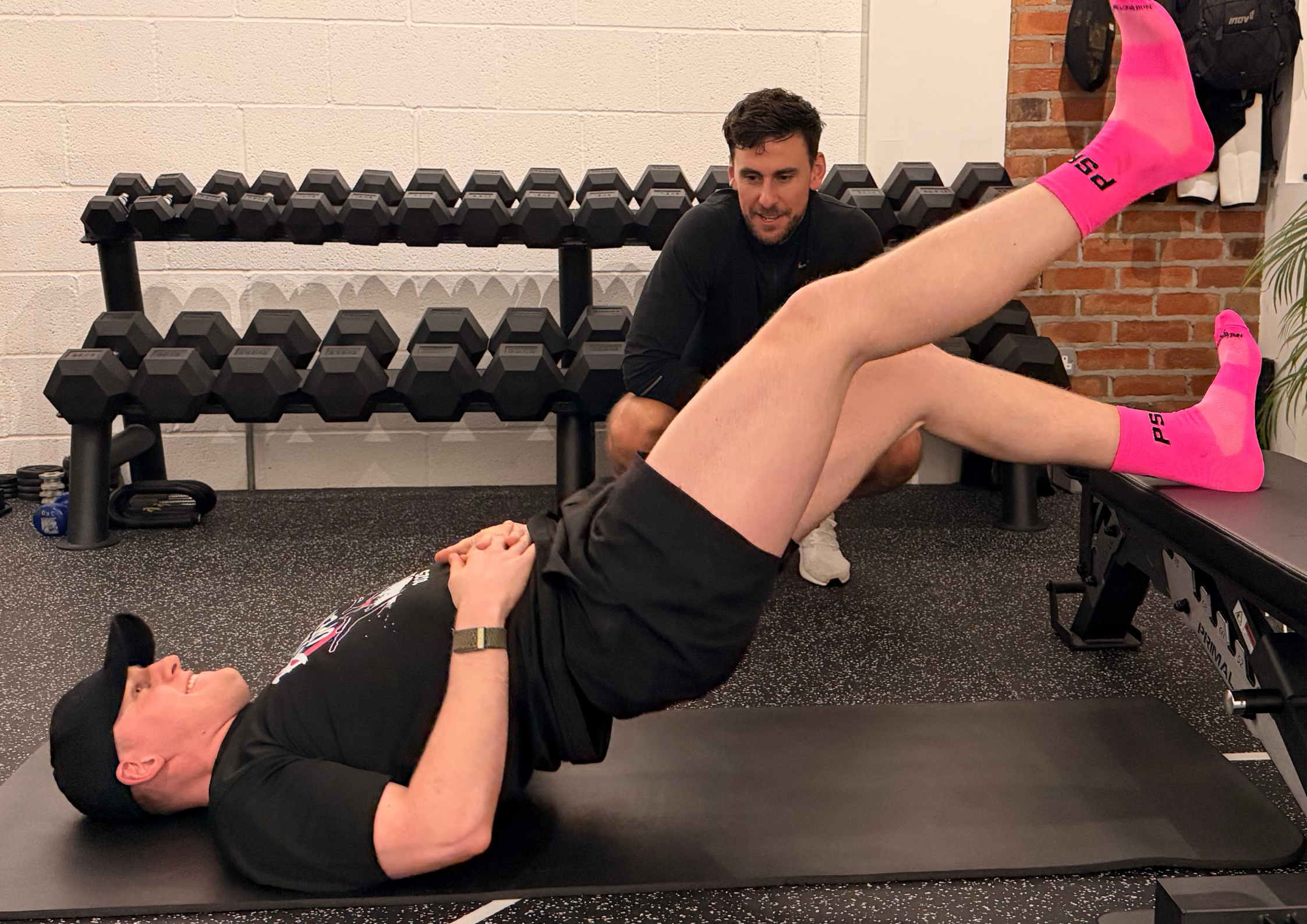 Athlete performing hamstring bridge test during performance testing & analysis session