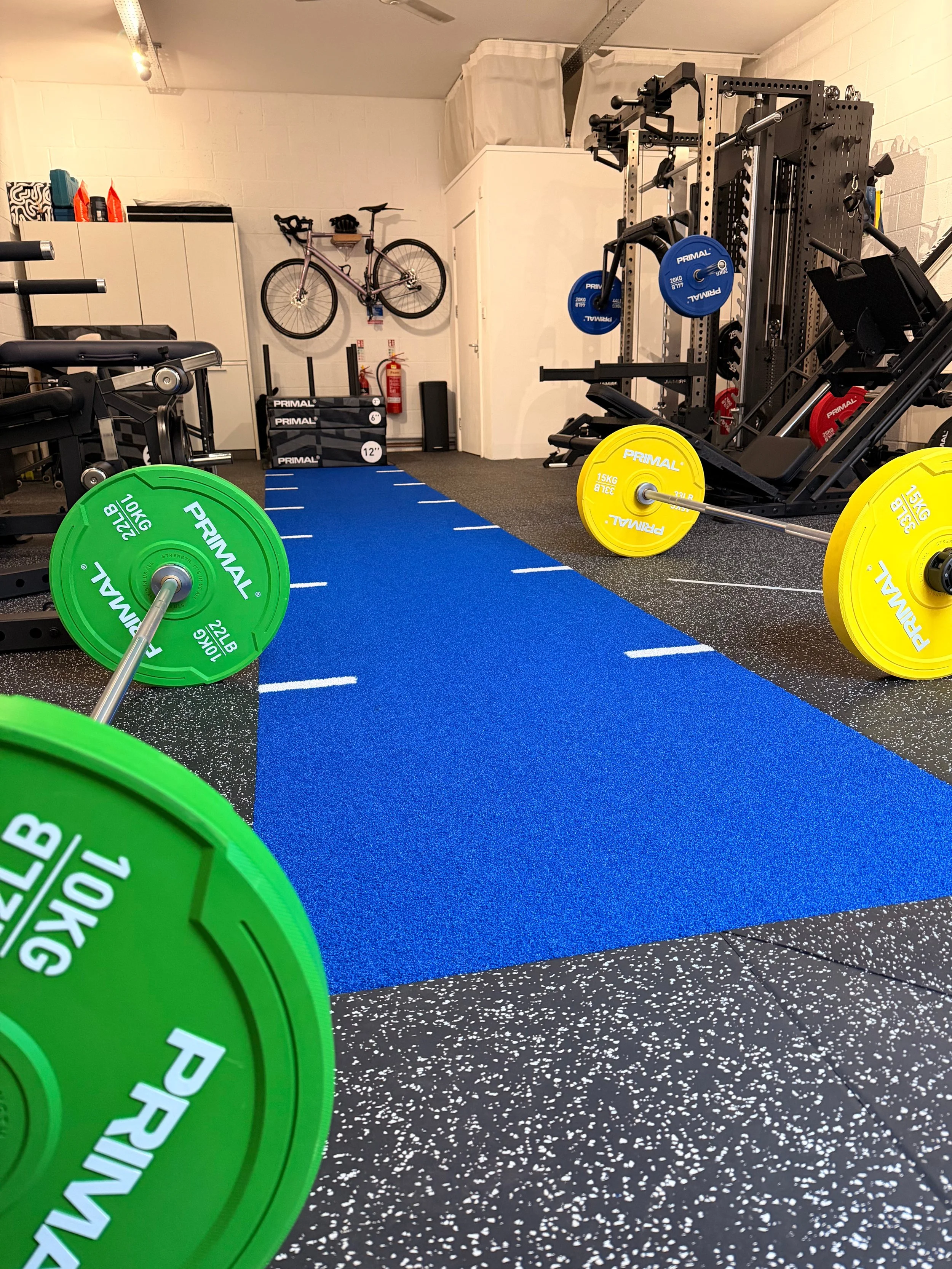 Group strength & conditioning class with personal training in gym clinic