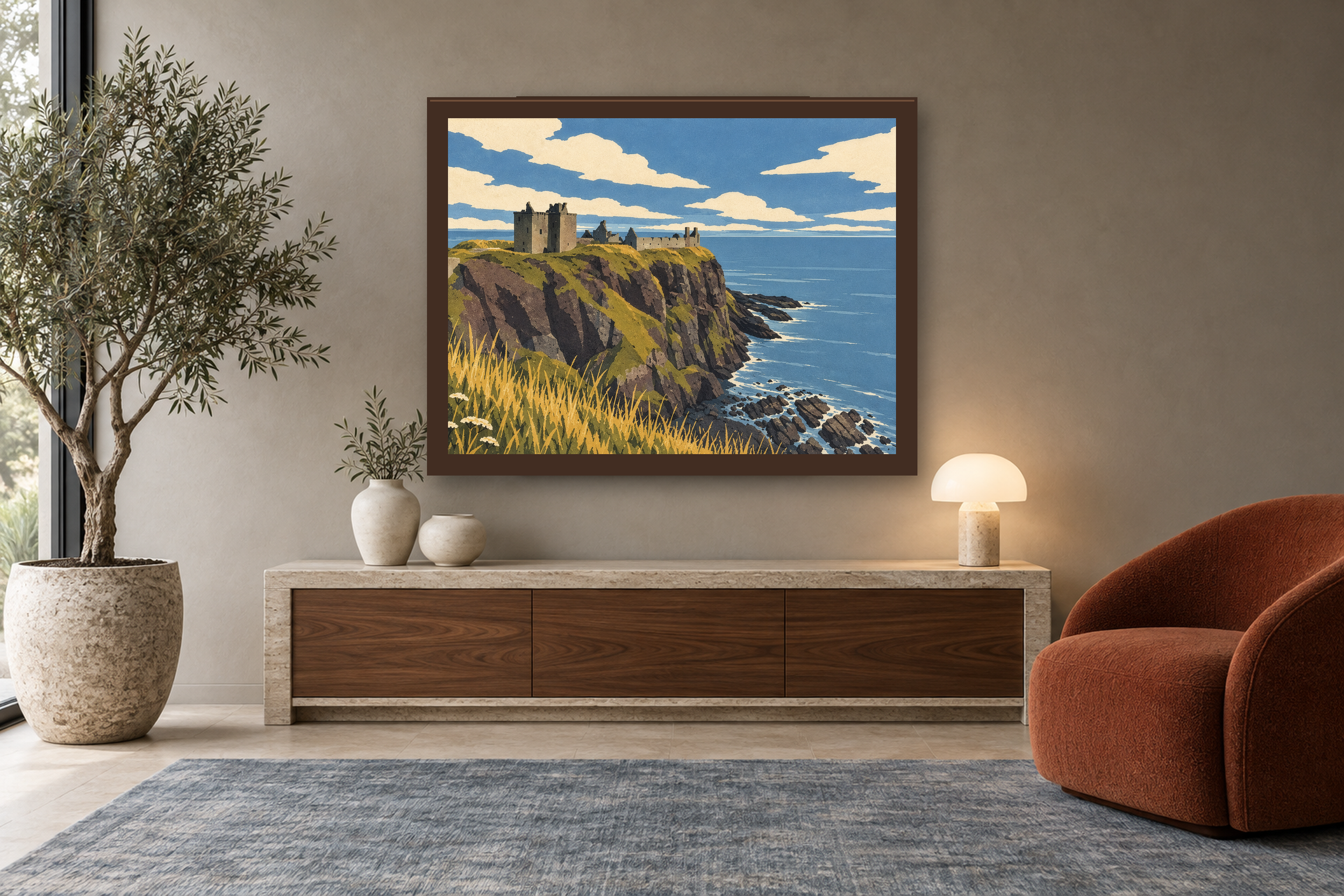 The Keep Above the Sea in the lithographic style, framed above a walnut console in a warm neutral reading room.