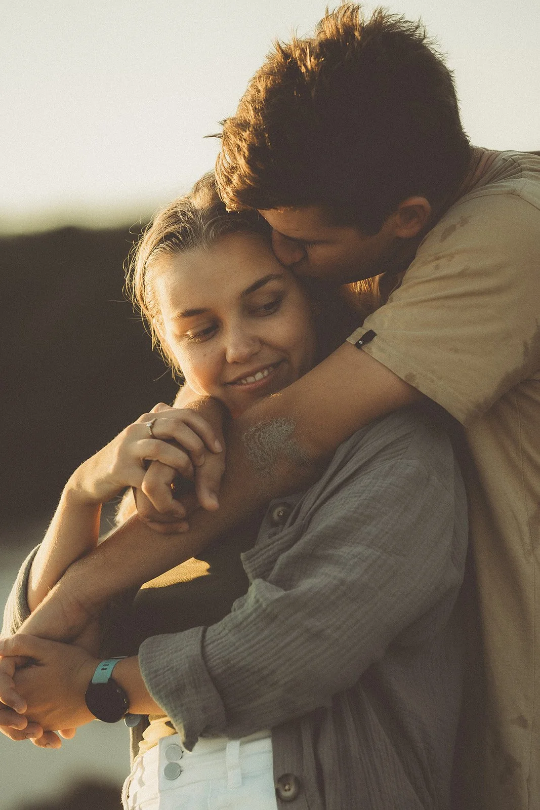 man and woman cuddling during their engagement session on the beach in ceduna eyre peninsula