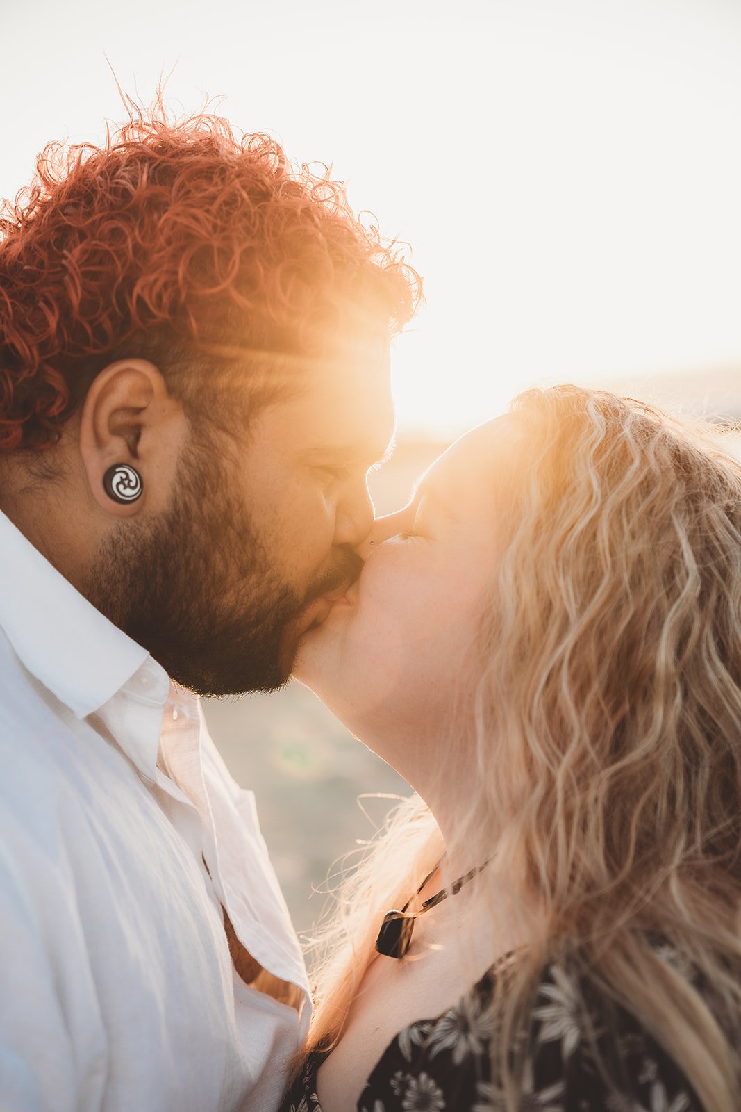 man and woman kissing at sunset during their engagement session in ceduna eyre peninsula