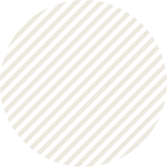 A circular pattern of alternating black and white diagonal stripes.