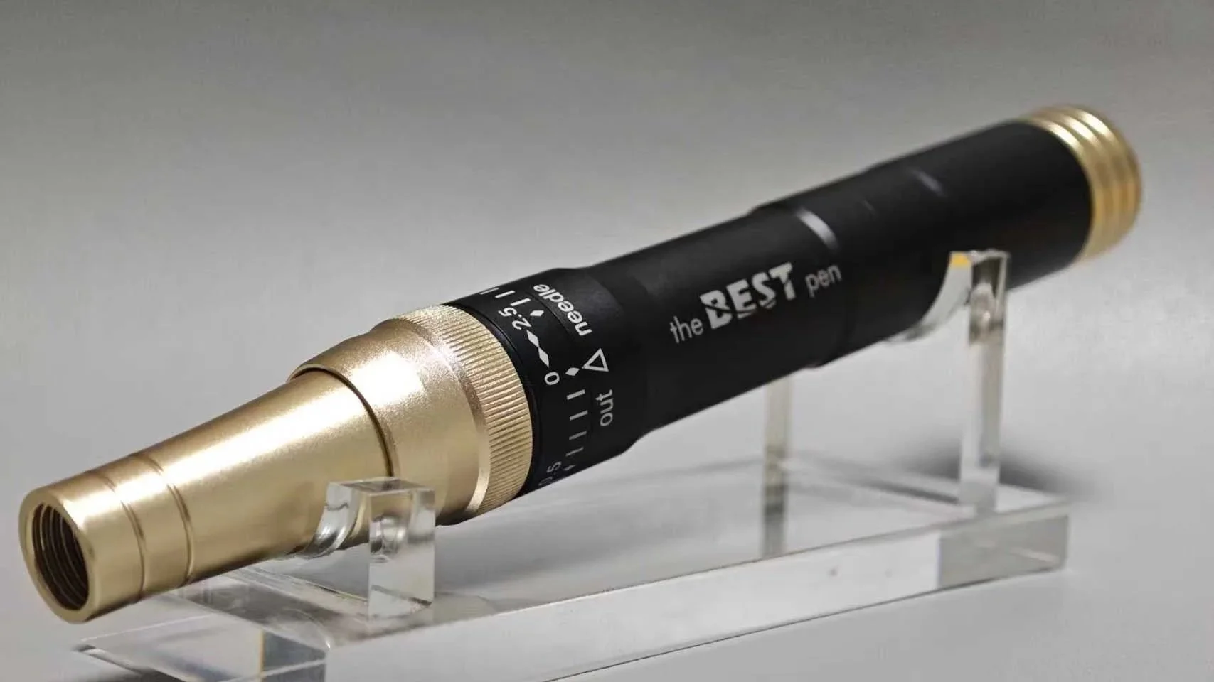 Professional aluminum microneedling device with adjustable depth shown on acrylic stand.
