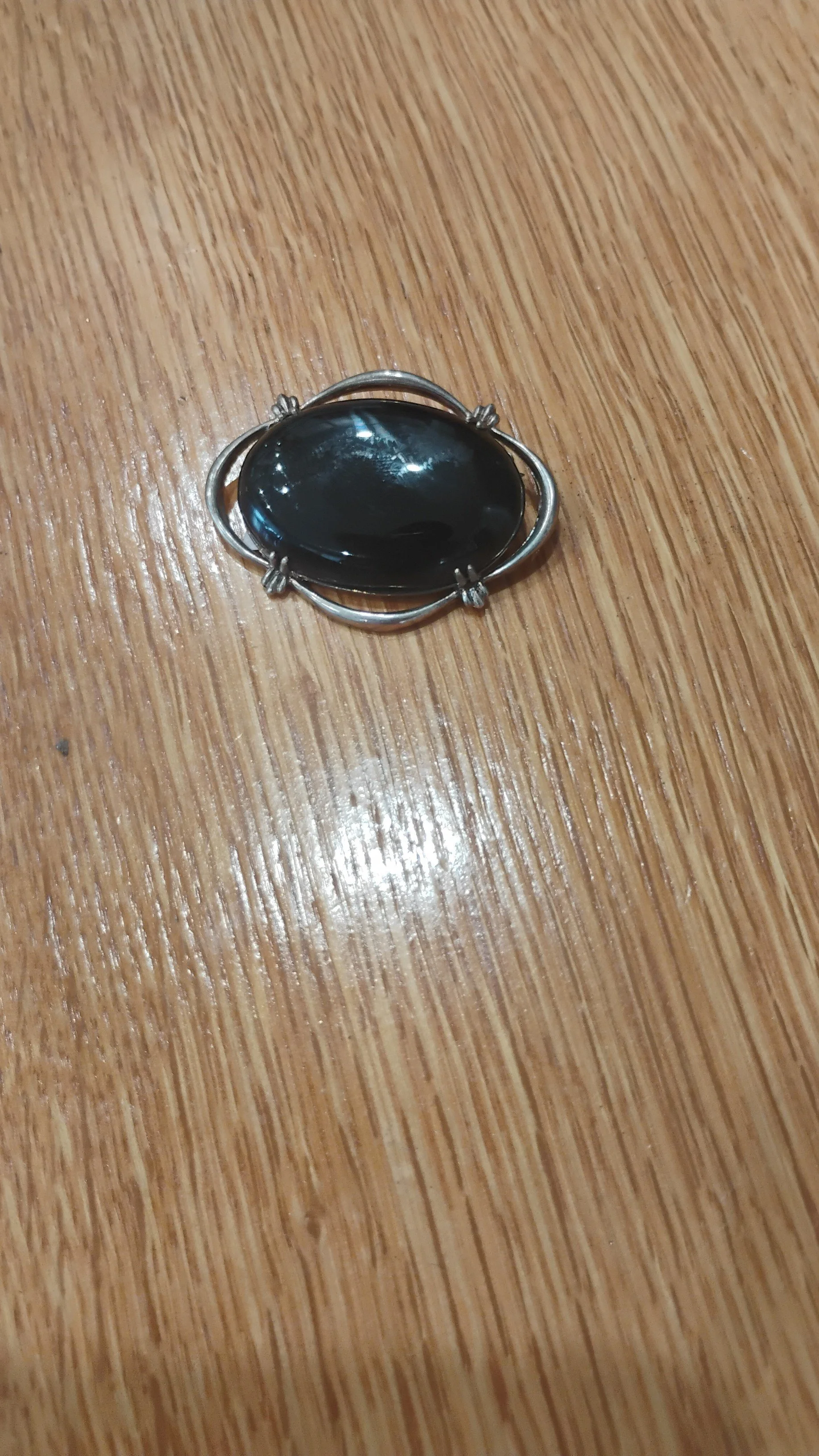 Obsidian brooch