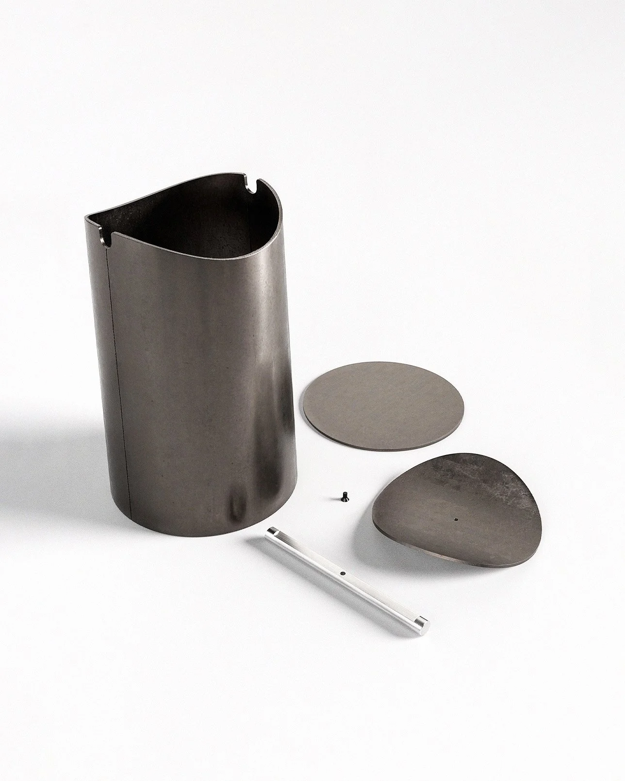 Flippy waste bin designed by Andrew Roberts, featuring a cone-shaped rolled steel body with fitted pivoting lid and minimal welded construction for modern interior use.