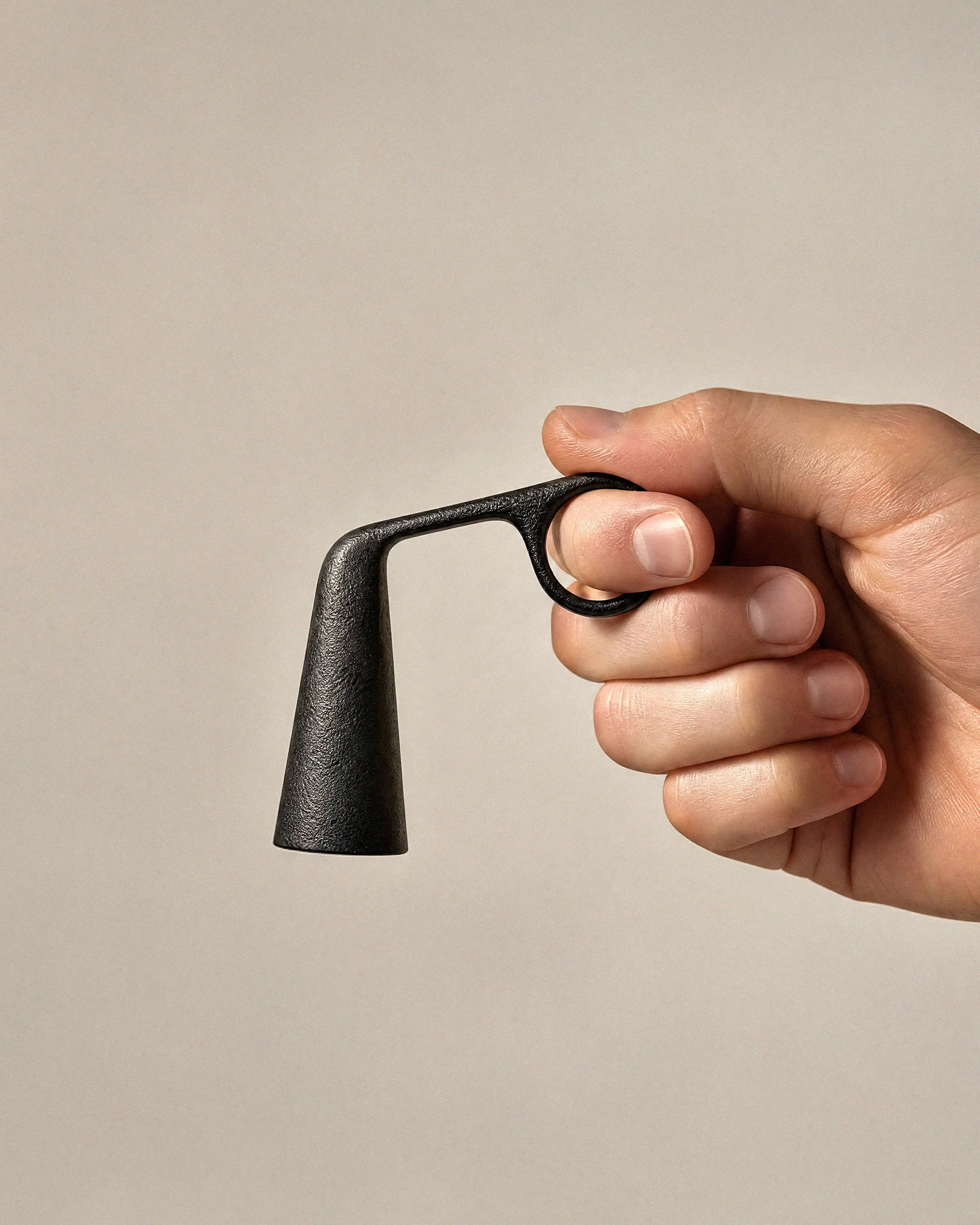 Snuffy is a cast metal candle snuffer by new zealand designer Andrew Roberts